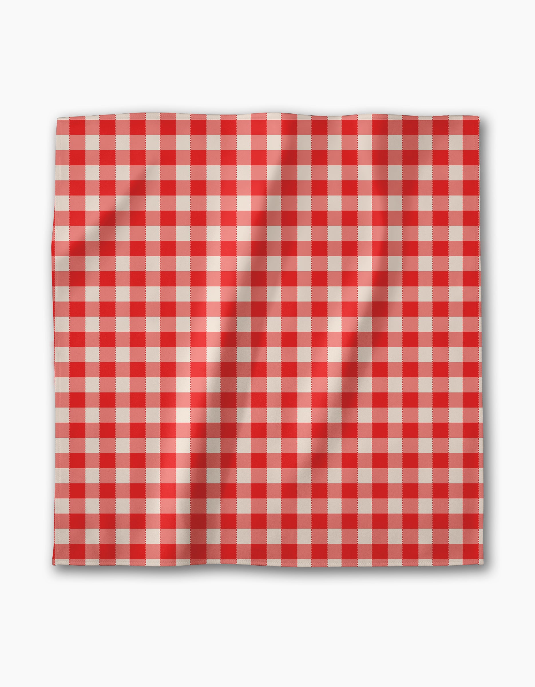 The Geometry Ripe Tomato Gingham dinner napkin set features square Geosuede fabric with a red and white checkered pattern, shown with gentle folds against a white background.