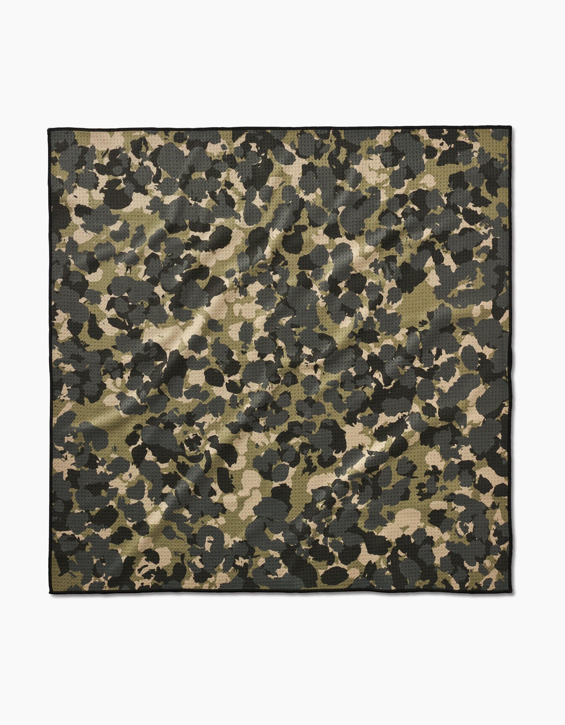 The Geometry Camo pet towel is a square, eco-friendly towel featuring a green, black, and beige camouflage pattern on a white background.