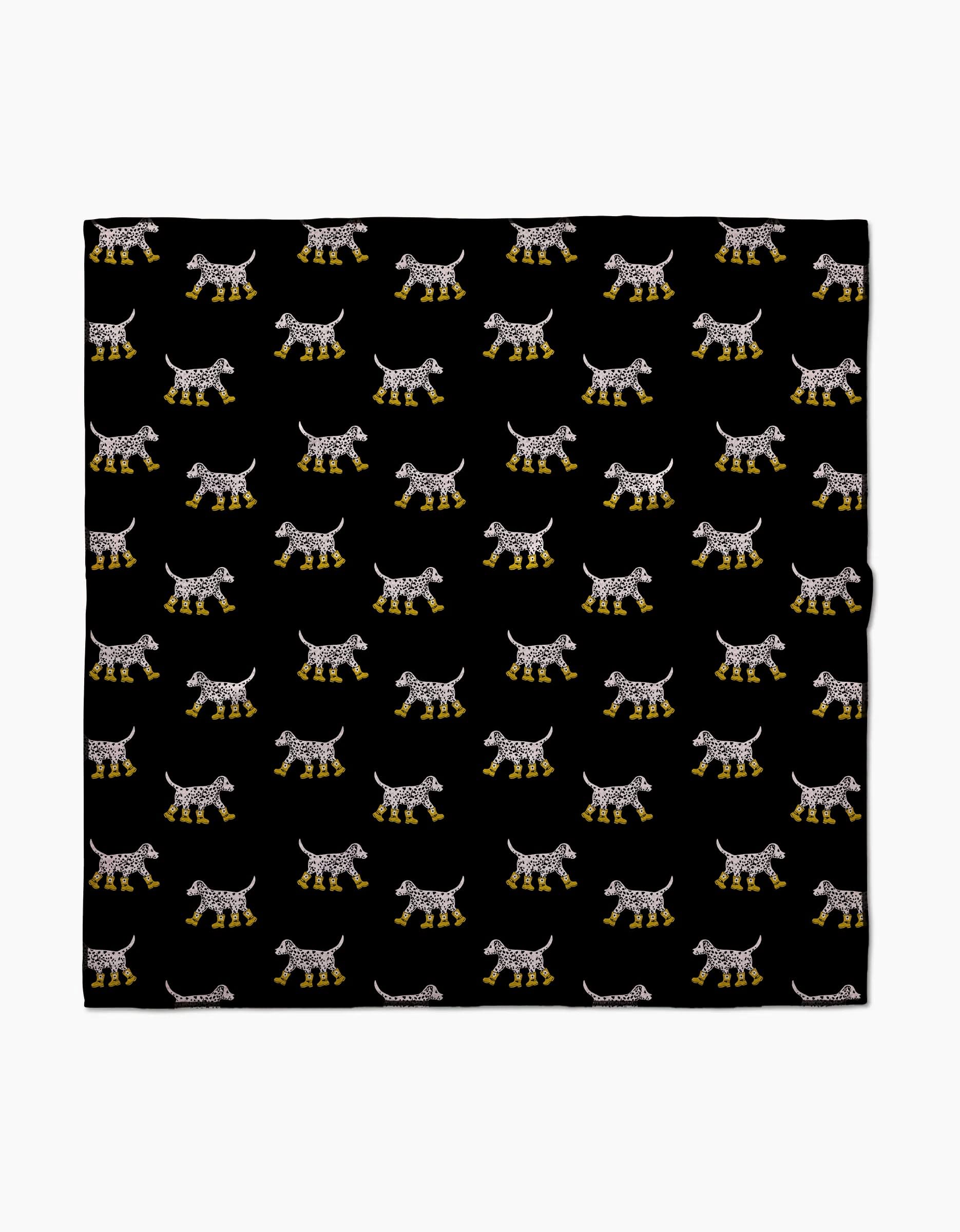 The Geometry Dalmatian In Boots Black dog towel is highly absorbent and quick drying, featuring a playful pattern of white Dalmatians in yellow boots, evenly spaced on a solid black background for a stylish look.