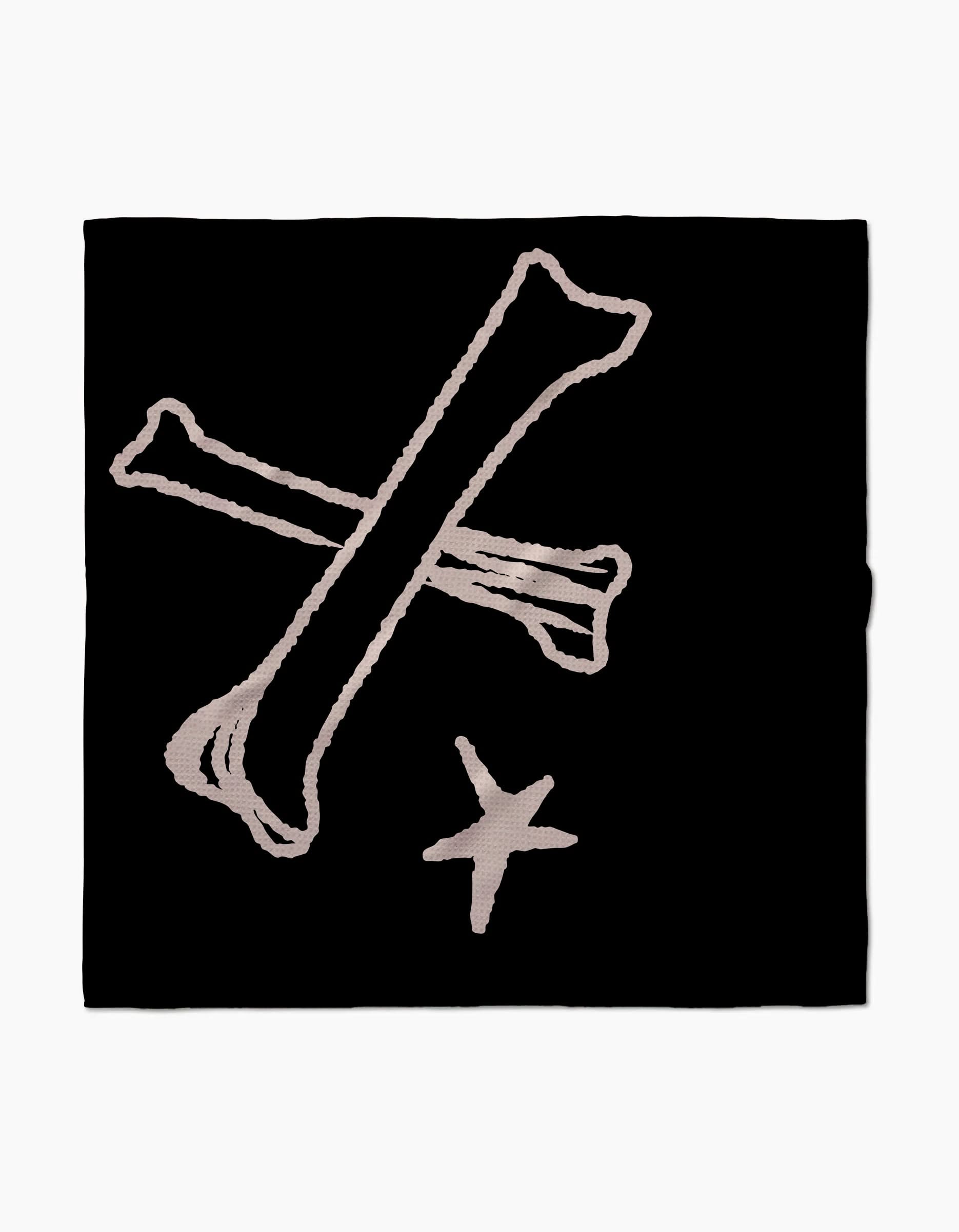 Dry Bones by Cole Strem features a black square with two white bones crossed in an X above a small four-pointed star—perfect for highly absorbent dog towels made from post-consumer recycled materials.