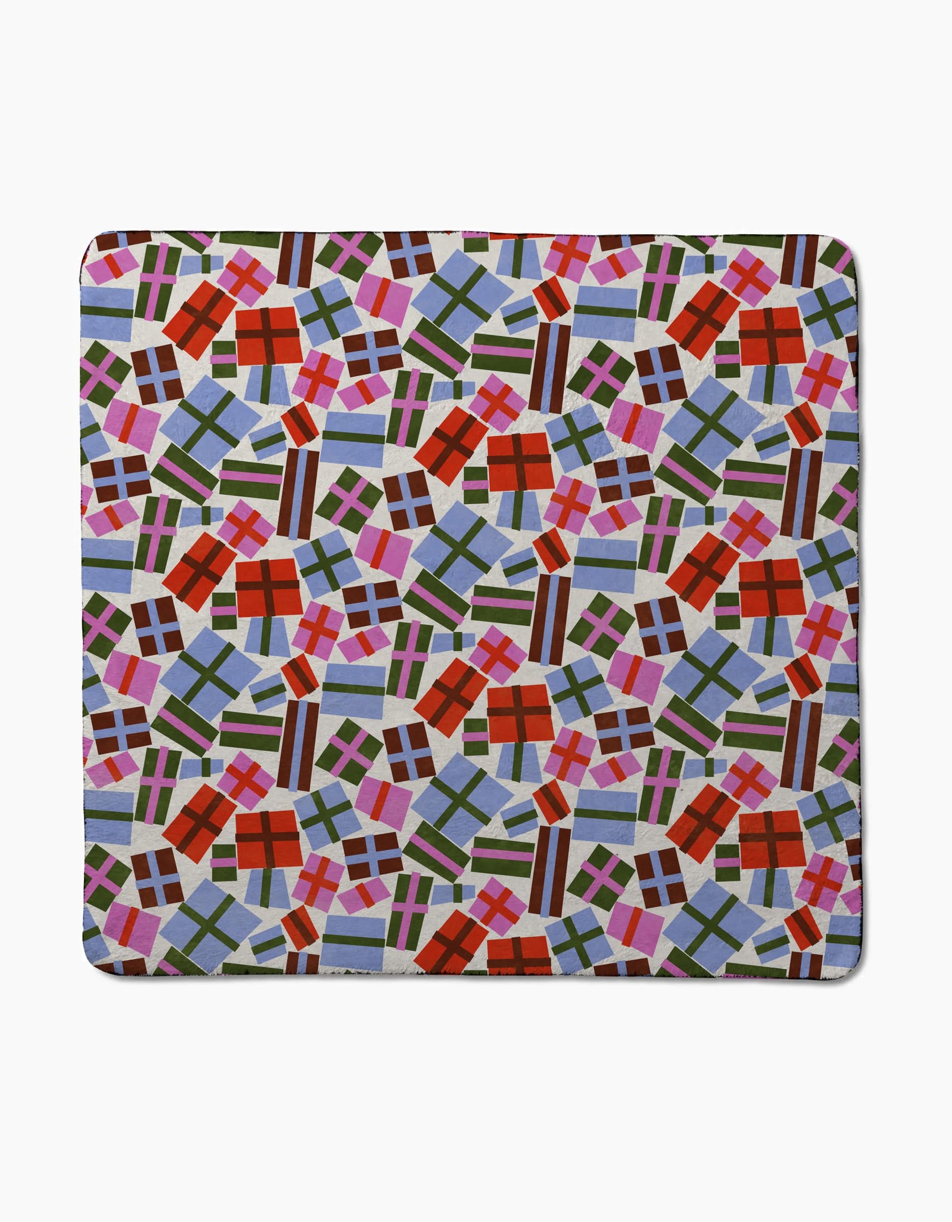 The Claire Iglesias Cheerful Presents mat is a square, ultra-absorbent plush towel made from recycled material, featuring a lively pattern of gift boxes with colorful ribbons on a light background.