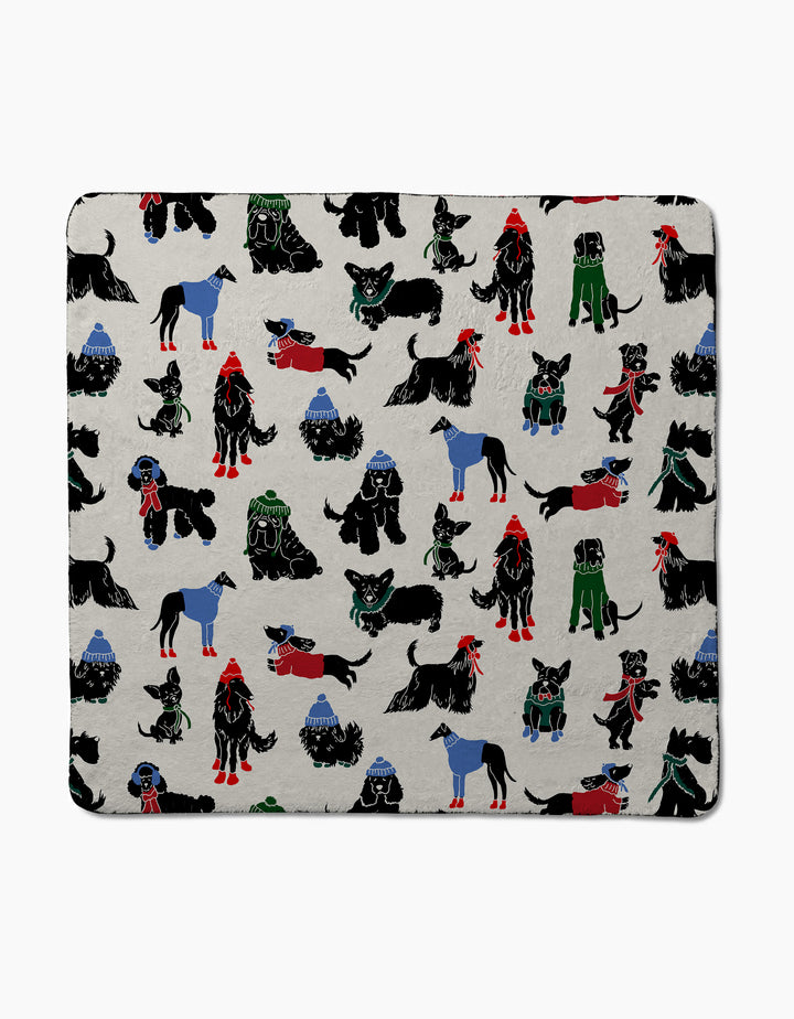 Dogue Magazine by Geometry showcases black dogs in colorful winter outfits with blue mountains on a light grey cover—an ideal cozy and cute pick for dog lovers.