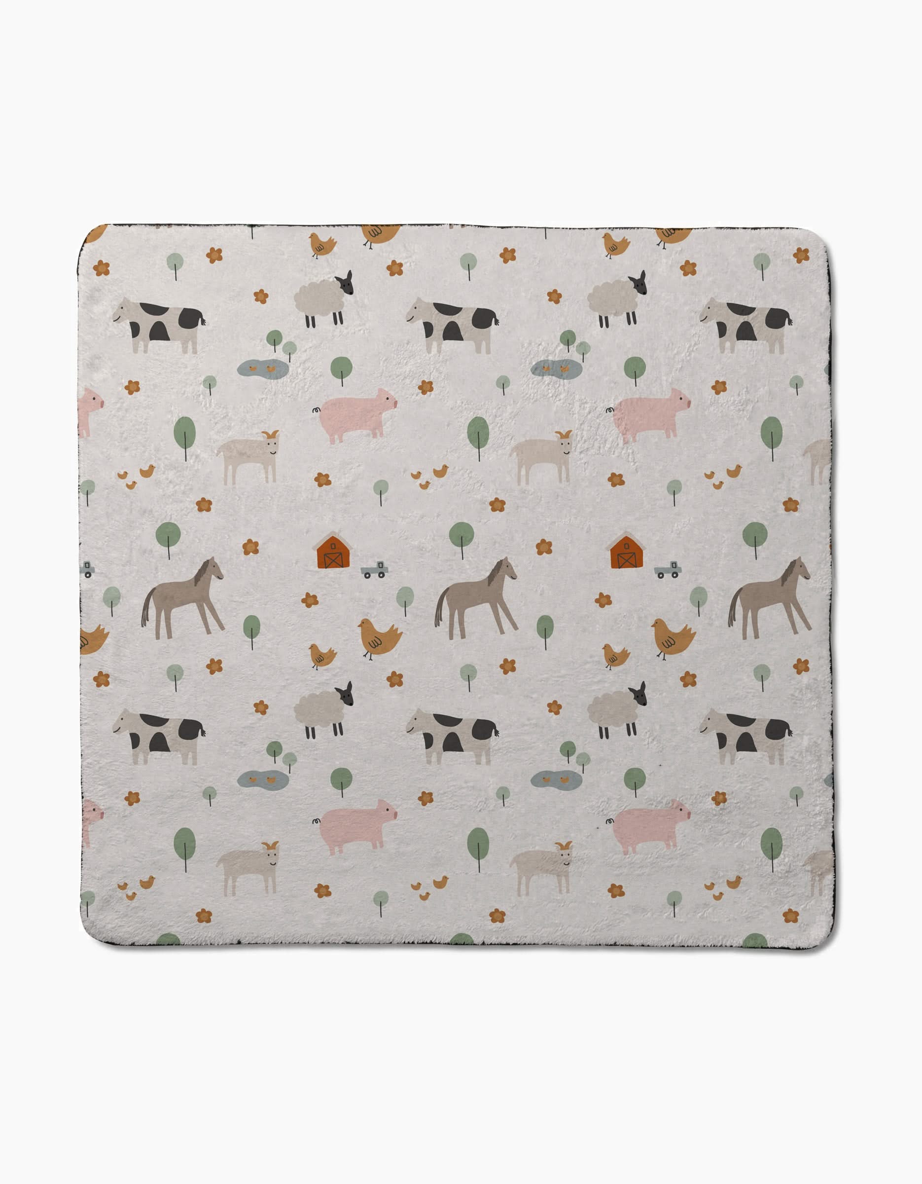 The Coit Creative Light Farm Animals blanket features a charming pattern of farm animals, trees, flowers, and dog houses on a light background, designed in the cozy style of a plush dog towel.