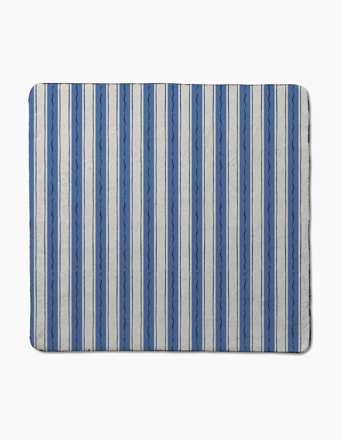 The Hufton Studio Scandi Stripes mat features vertical blue and light gray stripes with wavy zigzag patterns, crafted from recycled materials. This ultra-absorbent rectangular mat is set against a plain light background.