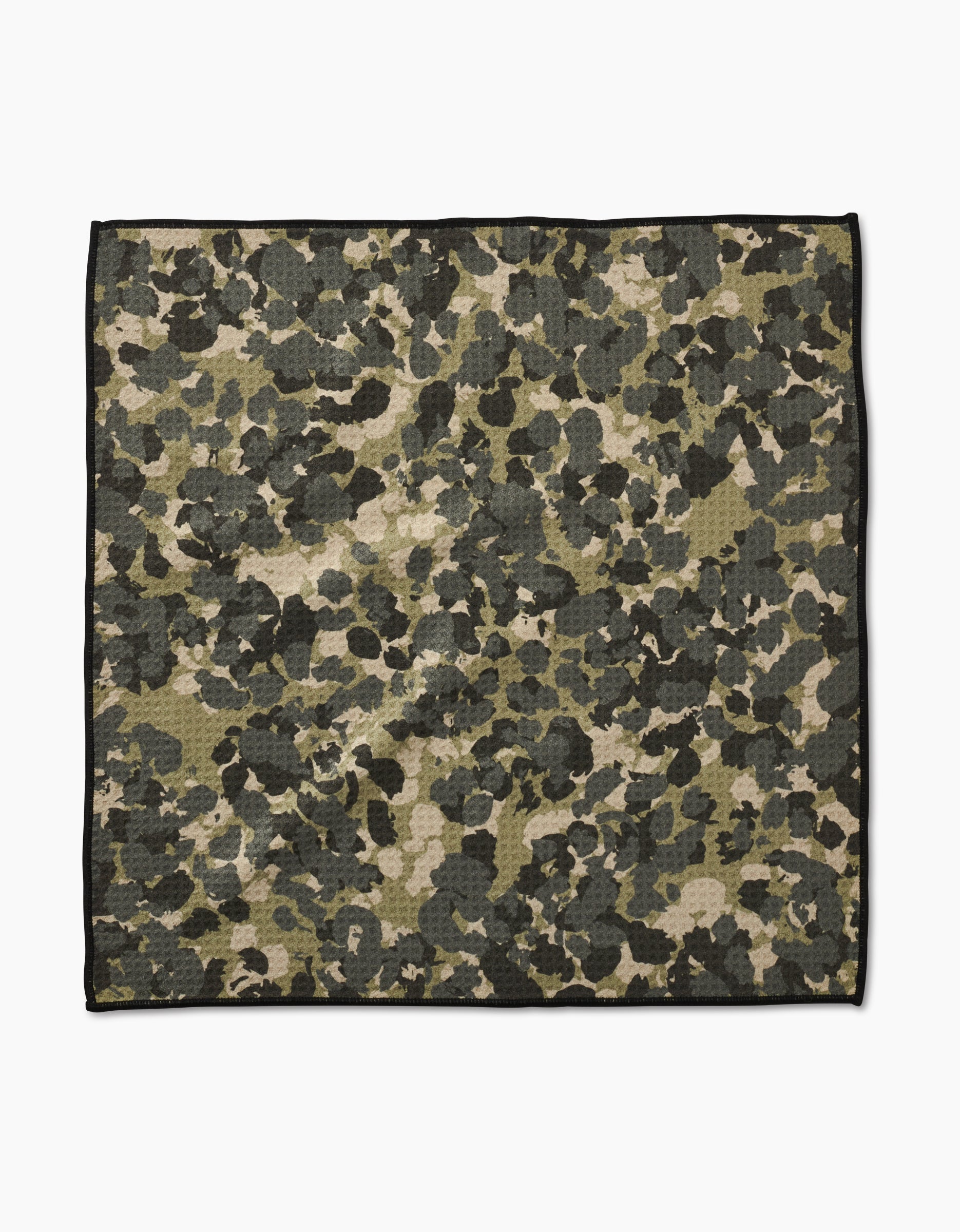 The Geometry Camo Paw Towel features a green, brown, and black camouflage pattern with a thin black border. Made from ultra-absorbent Geoweave fabric, it is shown flat on a white background.