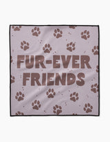 The Geometry Fur Ever Friends blanket is light purple, crafted from ultra-absorbent Geoweave fabric, and displays FUR-EVER FRIENDS in bold brown letters with scattered brown paw prints.