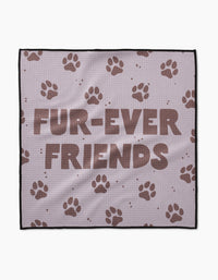 The Geometry Fur Ever Friends blanket is light purple, crafted from ultra-absorbent Geoweave fabric, and displays FUR-EVER FRIENDS in bold brown letters with scattered brown paw prints.