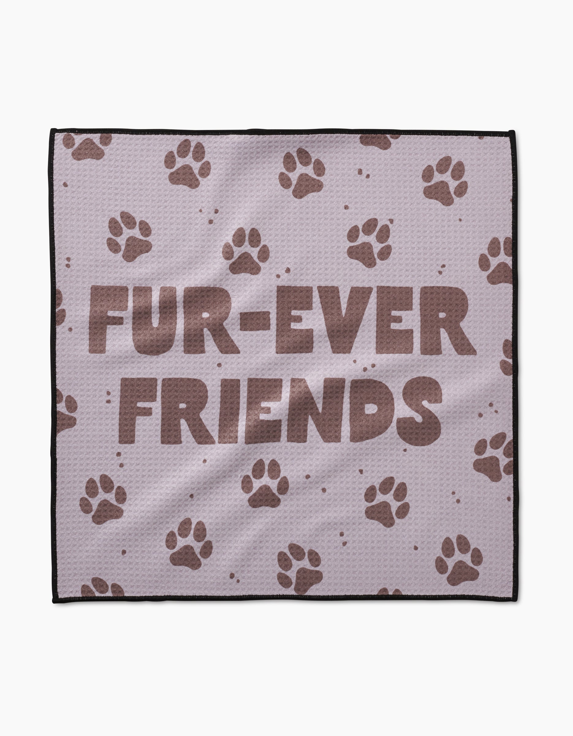 The Geometry Fur Ever Friends blanket is light purple, crafted from ultra-absorbent Geoweave fabric, and displays FUR-EVER FRIENDS in bold brown letters with scattered brown paw prints.