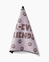 A light purple Geometry Fur Ever Friends Paw Towel with brown paw prints and partial -EVER FRIENDS text, made from ultra-absorbency Geoweave fabric, hangs from a black loop against a white background.