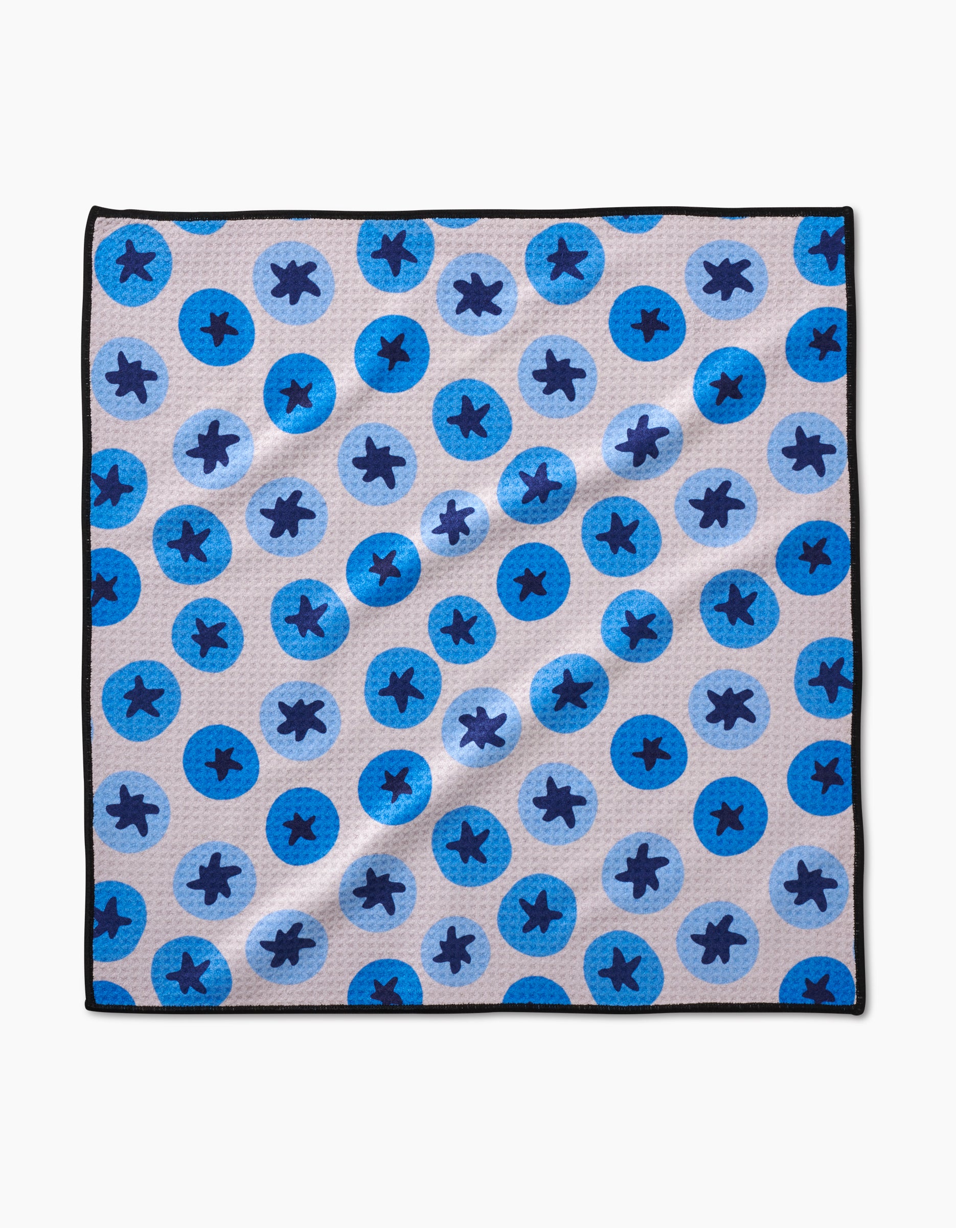 The Geometry Sweet Blueberries Paw Towel features a blue circle pattern on a light background with black border, crafted from ultra-absorbent Geoweave fabric.