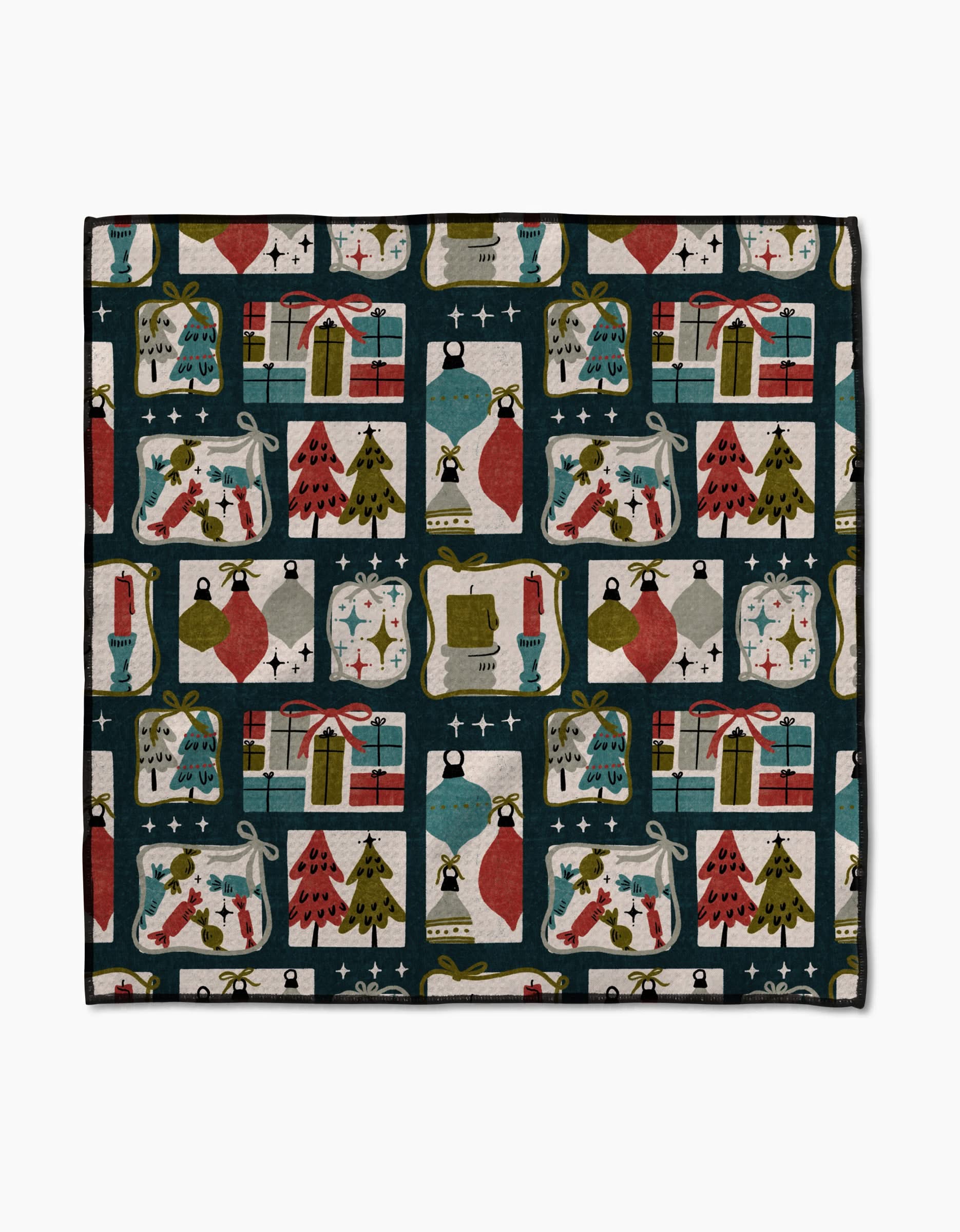 The Amy MacCready Cady Dark blanket features ultra-absorbent Geoweave fabric and a festive pattern of gifts, Christmas trees, stockings, ornaments, candles, and stars in red, green, blue, and gold on black.