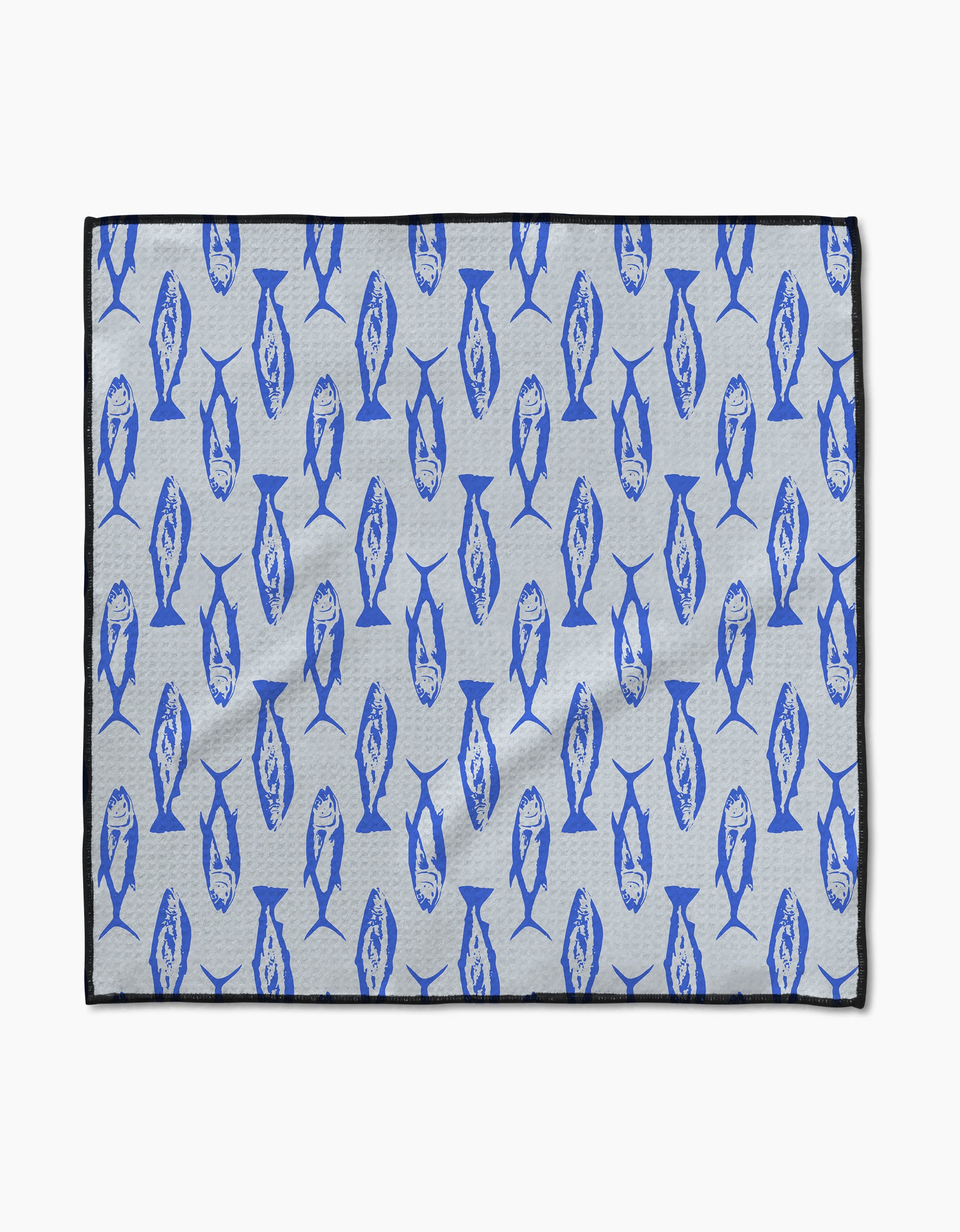 The Geometry Coastal Catch mat features a light gray background with blue fish in various directions, a thin black border, and is crafted from ultra-absorbent Geoweave fabric.