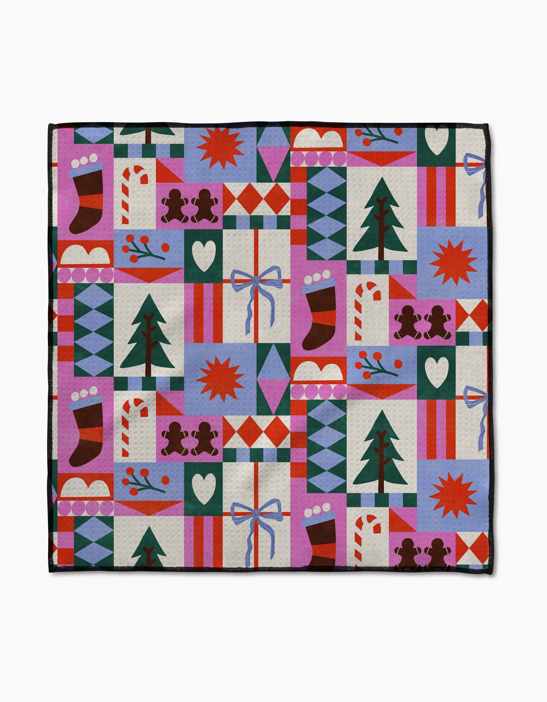 The Claire Iglesias Festive Christmas Quilt features a colorful patchwork of trees, stockings, and gifts—crafted from recycled pet towel material for cozy comfort in red, green, blue, purple, and white.