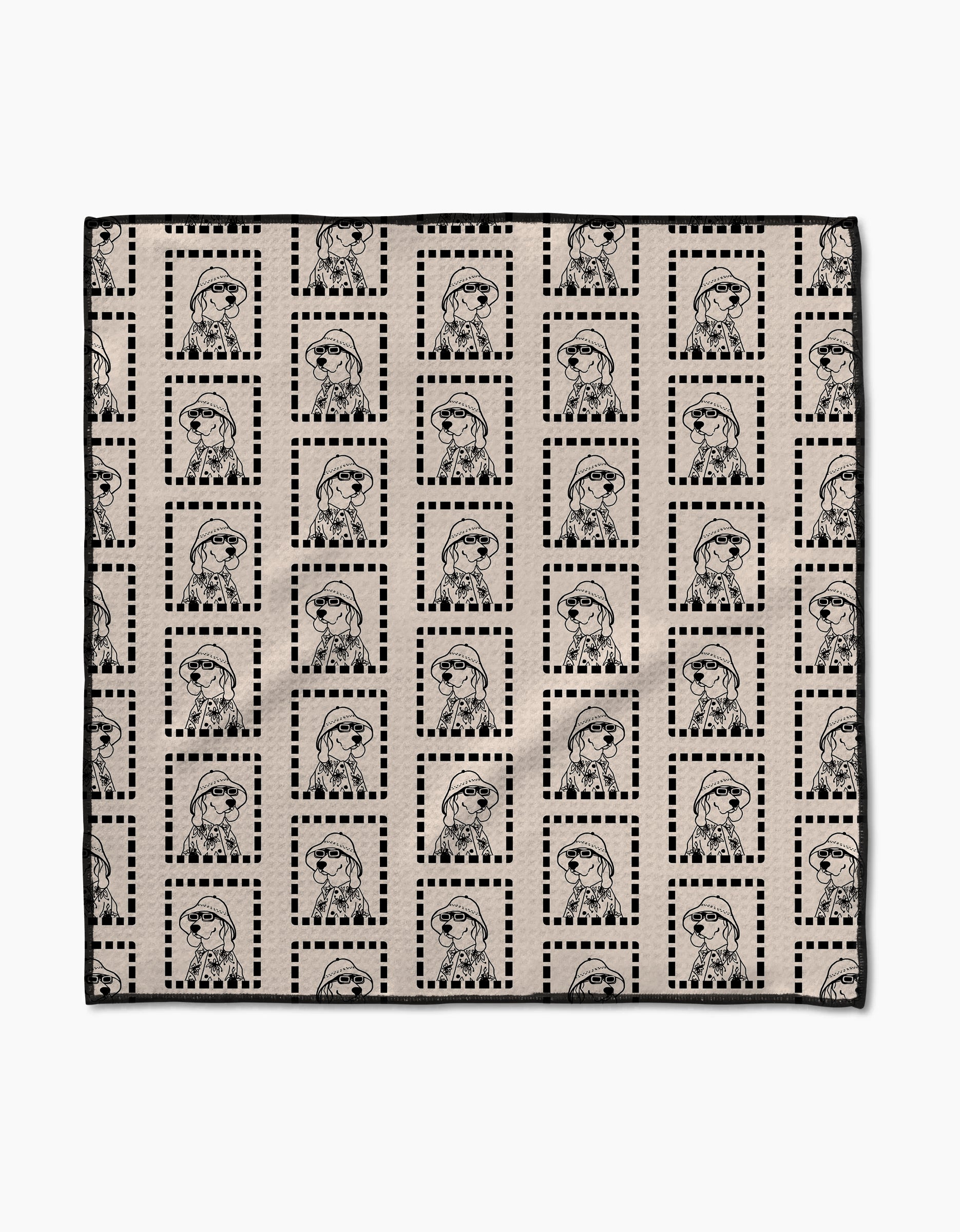 The Ready For Summer Doggy Paw Towel by Geometry features beige Geoweave fabric with a grid of dotted black squares and outlined figures in berets and jackets, combining stylish design with ultra-absorbent performance.