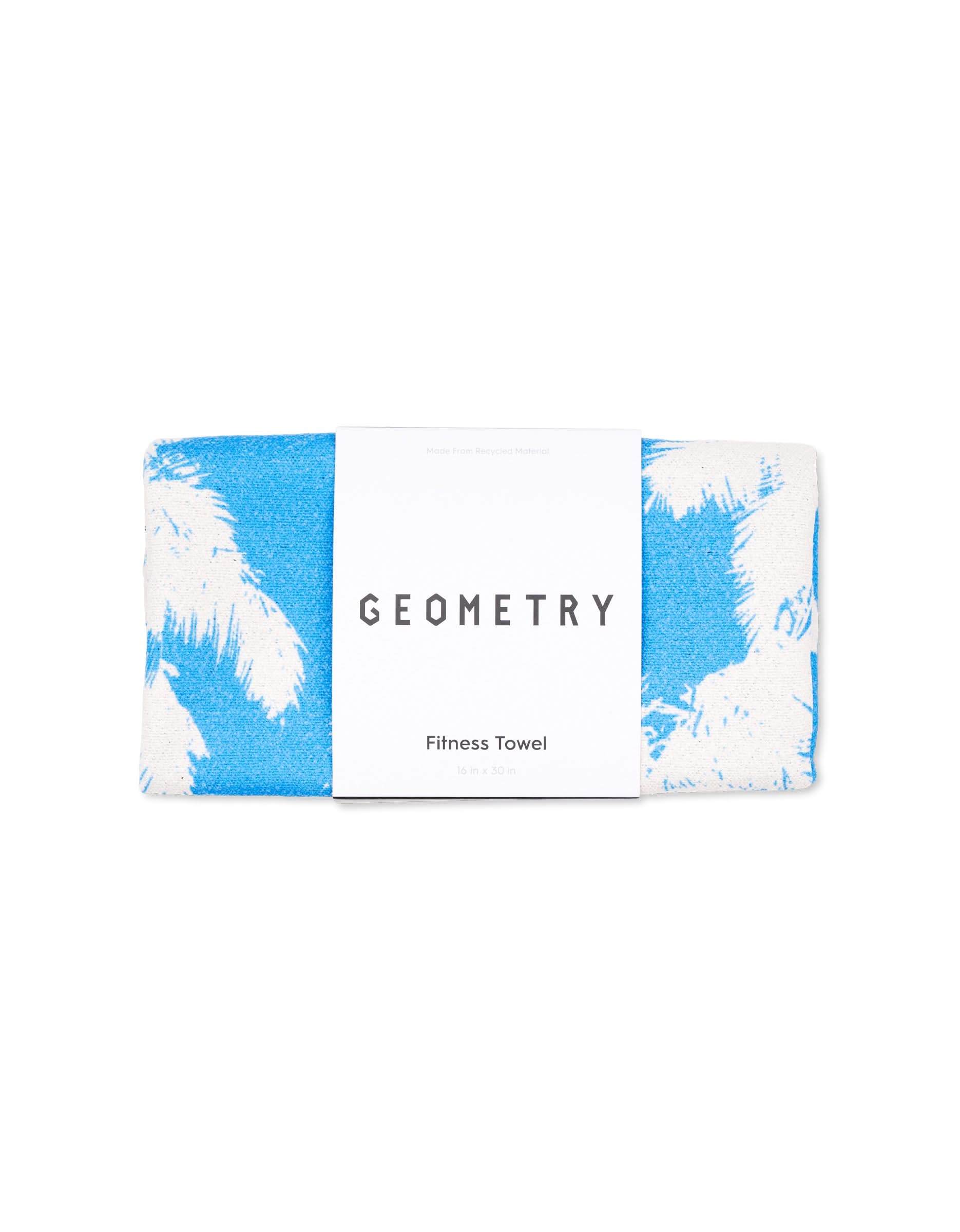 A folded, ultra-absorbent GEOMETRY Magna - Blue Palms fitness towel features a blue and white palm tree pattern. Made from recycled material, its neatly packaged with a white label and ready for use.