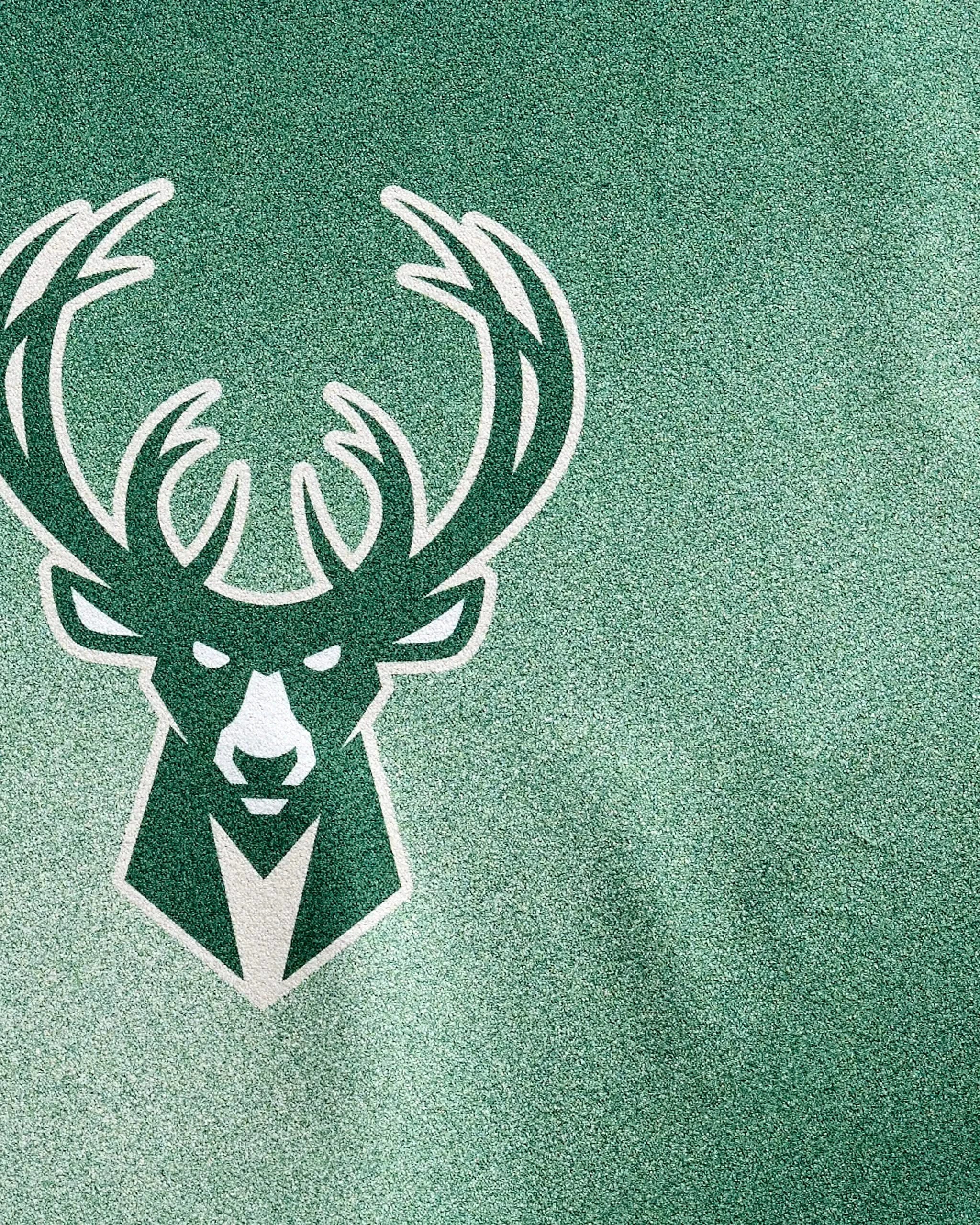 The Bucks Fade towel by NBALAB x Geometry features a white and dark green deer head with large antlers on a textured green background—perfect as an NBA fitness or quick-drying gym towel for true Milwaukee Bucks fans.