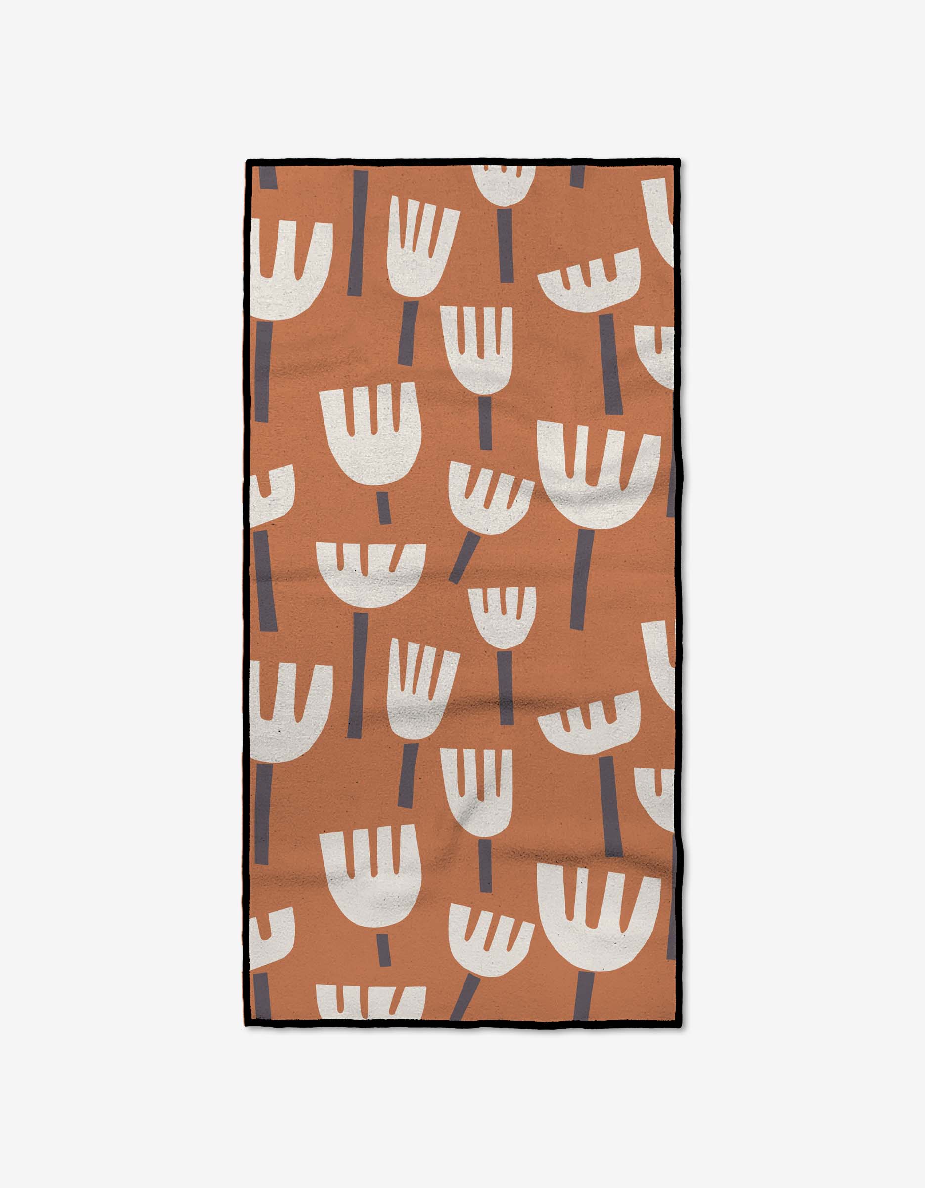 The Cutout Flowers fitness towel by Claire Iglesias features upright white abstract blooms with gray stems on a brown background, printed on ultra-absorbent recycled fabric.