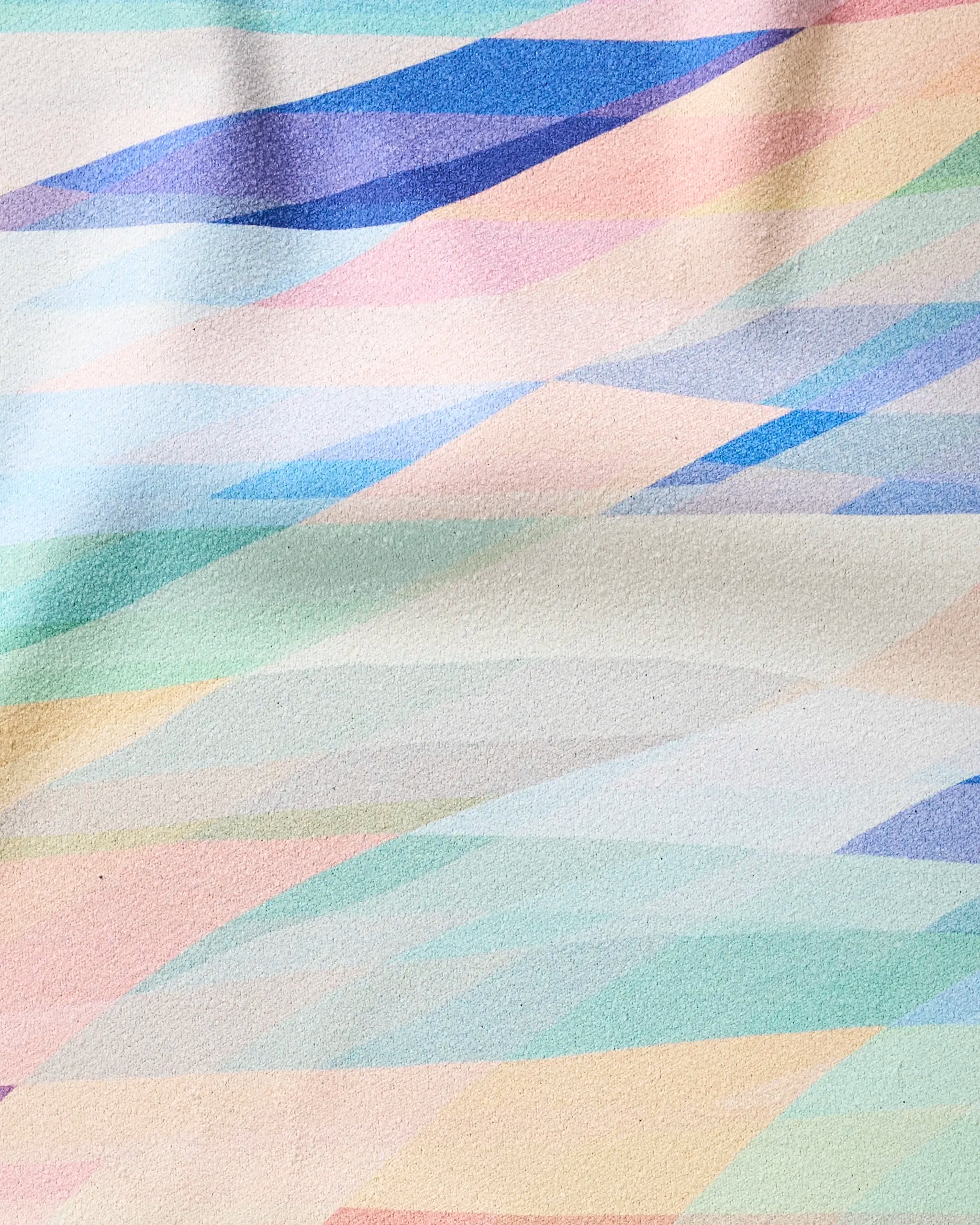 Eventide by Rachel Parker features abstract watercolor waves in blue, pink, green, yellow, and purple on textured paper, blending softly like the smooth finish of an ultra-absorbent fitness towel.