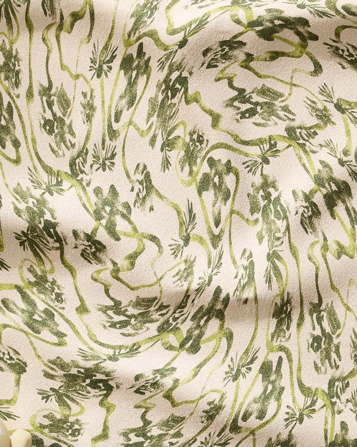 Geometry’s Floral Swirls Green fitness towel features a beige recycled fabric with an abstract green floral pattern, creating a textured, organic look. Ultra-absorbent folds and a soft surface make it perfect for your workout routine.