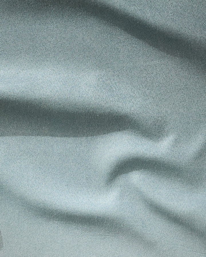 Light gray "Foundation" towel by GEOMETRY features soft, smooth fabric with gentle folds and subtle wavy patterns—ideal as a fast-drying fitness accessory.