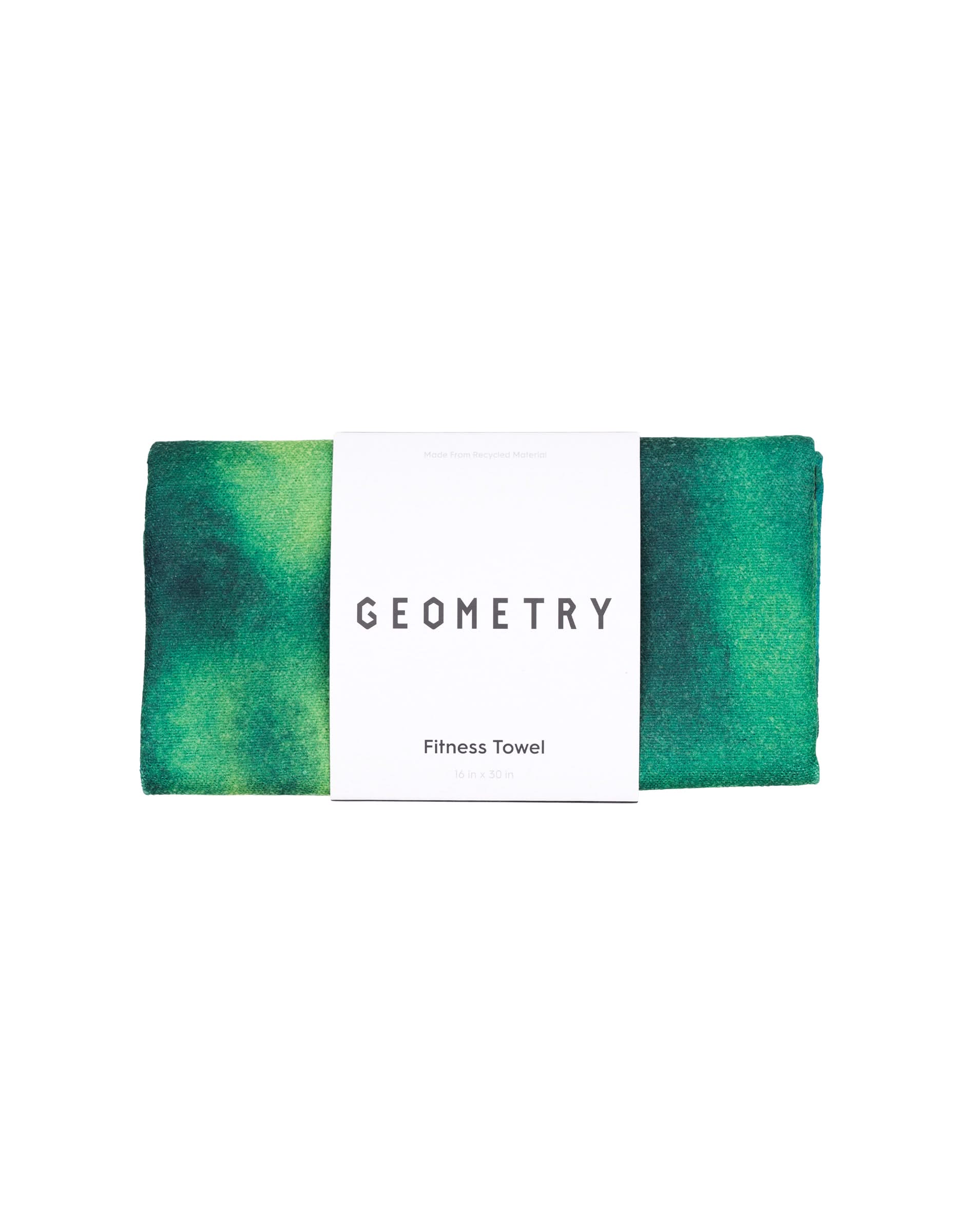 A green and dark blue gradient ultra-absorbent fitness towel, folded neatly with a white paper label around it, features the brand GEOMETRY and product name Magna - Greens.
