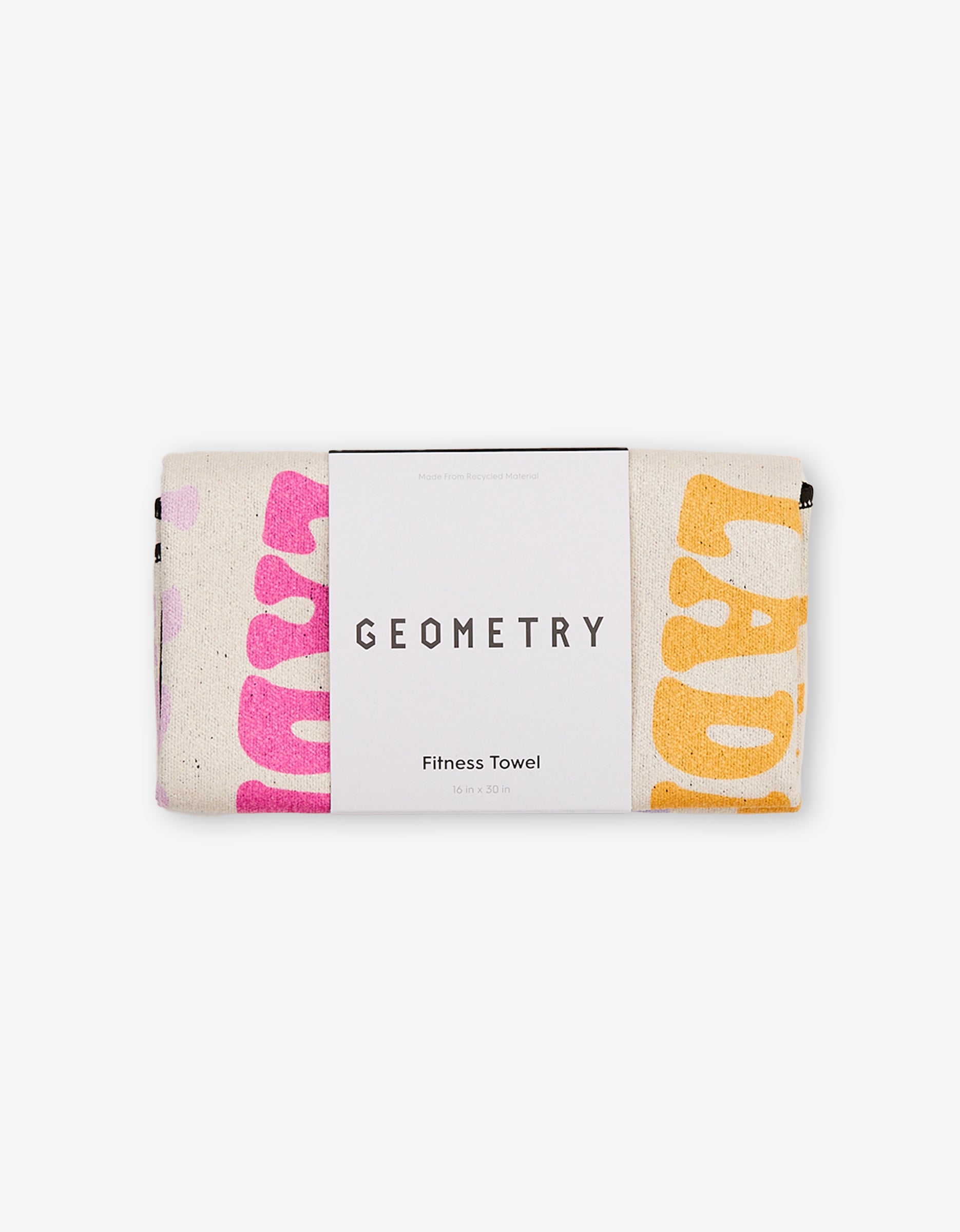 A folded ultra-absorbent GEOMETRY Fitness Towel, labeled GEOMETRY Fitness Towel, made from recycled materials. The towel, called Ladies Only, displays colorful pink and yellow prints on a light background.