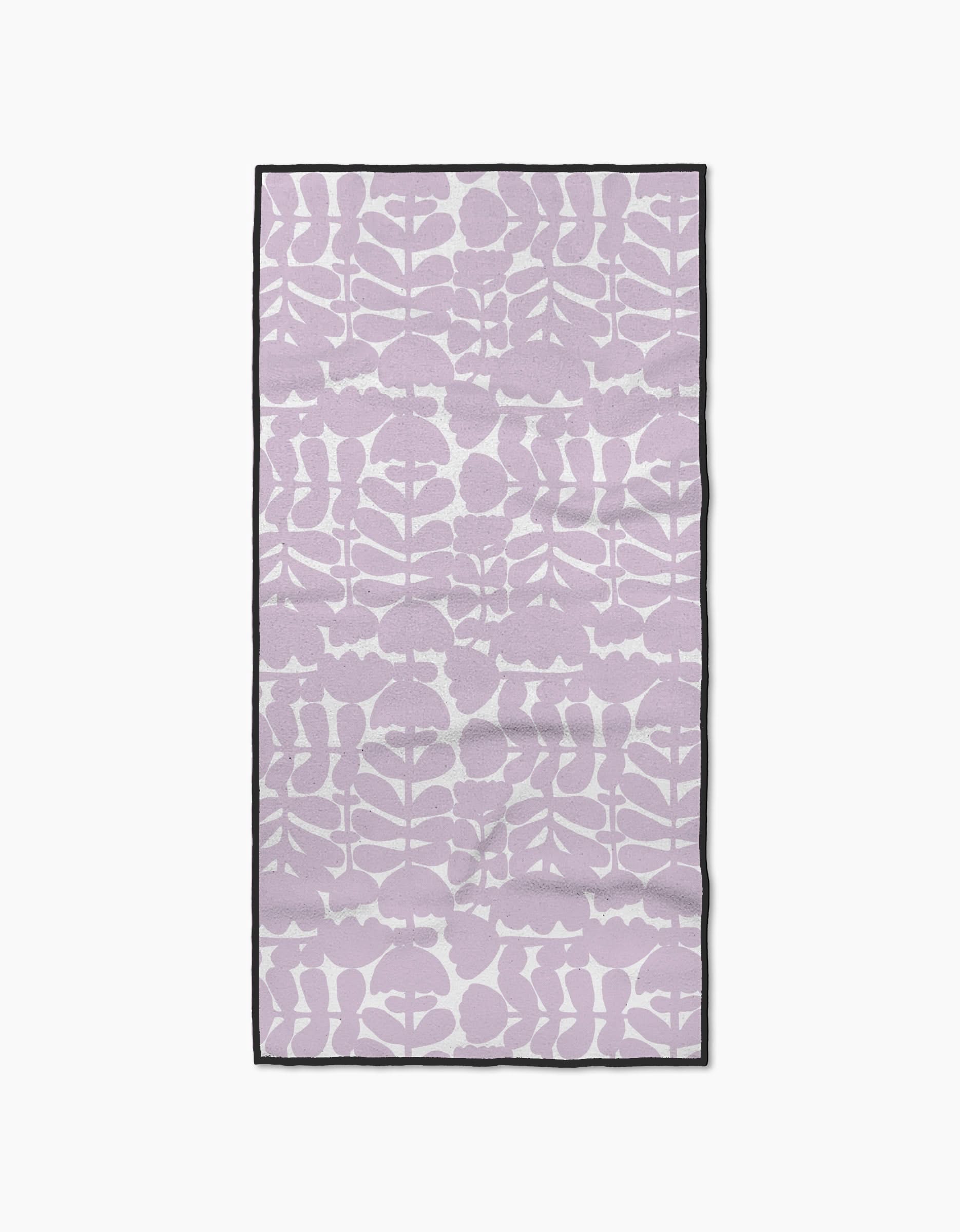 The Katie OShea Lavender Scandi Flowers towel features a rectangular, ultra-absorbent design with a light purple and white abstract botanical pattern and a slim black border, shown flat on a white background.