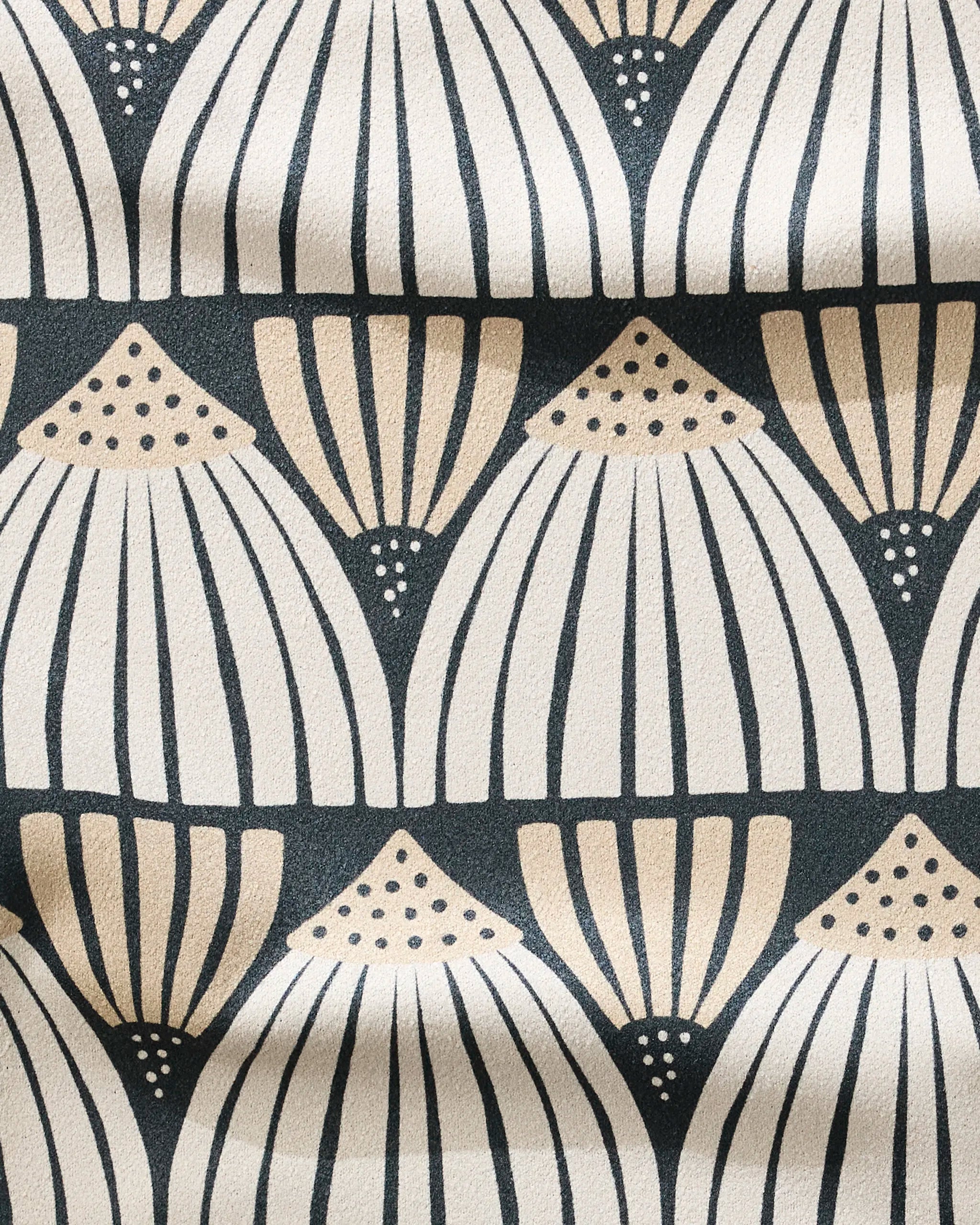 Letitia by Amy MacCready features a beige and cream fan-shaped geometric pattern with dotted accents on a dark background. This ultra-absorbent, fast-drying fitness towel has visible gentle folds, ideal for your workout routine.