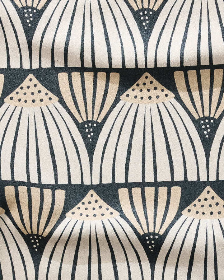 Letitia by Amy MacCready features a beige and cream fan-shaped geometric pattern with dotted accents on a dark background. This ultra-absorbent, fast-drying fitness towel has visible gentle folds, ideal for your workout routine.