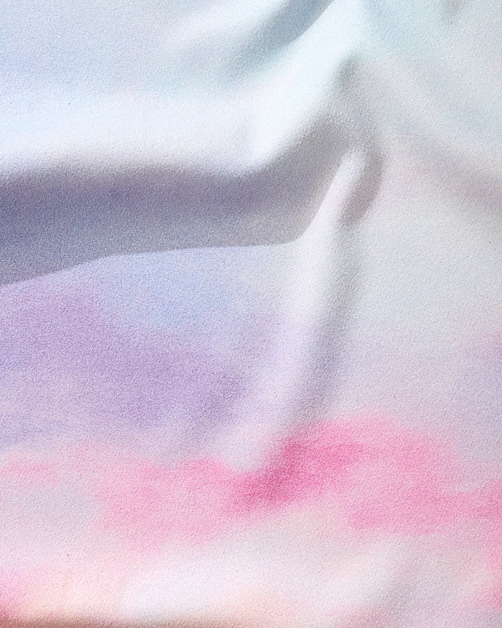 The Magic In The Sky fitness towel by Stefanie Bales features a dreamy gradient of lavender, pink, and light blue. Ultra-absorbent and quick-drying, it's the perfect stylish addition to your workout routine.