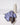 A gray water bottle with a straw sits on a white surface next to Geometry’s ultra-absorbent Moody Autumn Mushrooms fitness towel, draped in purple and adorned with a black mushroom pattern.