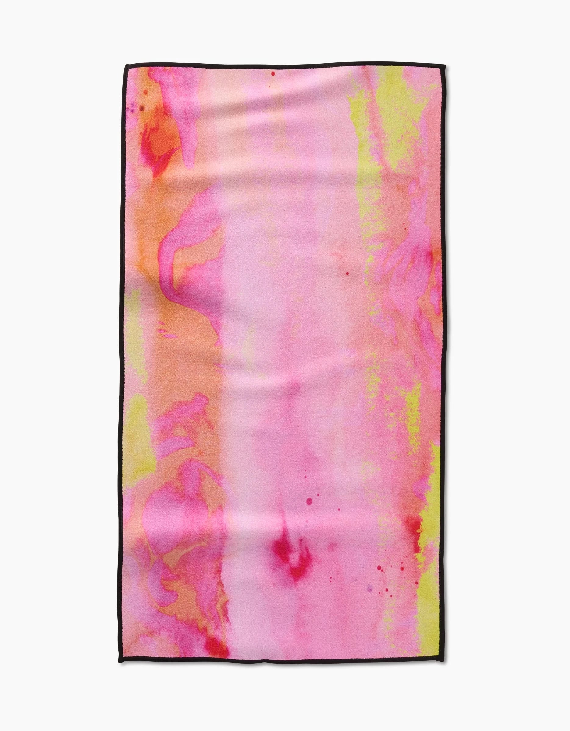 The GEOMETRY Purity towel features a vibrant pink, orange, and yellow watercolor abstract design with black trim, made from ultra-absorbent Geoweave fabric.
