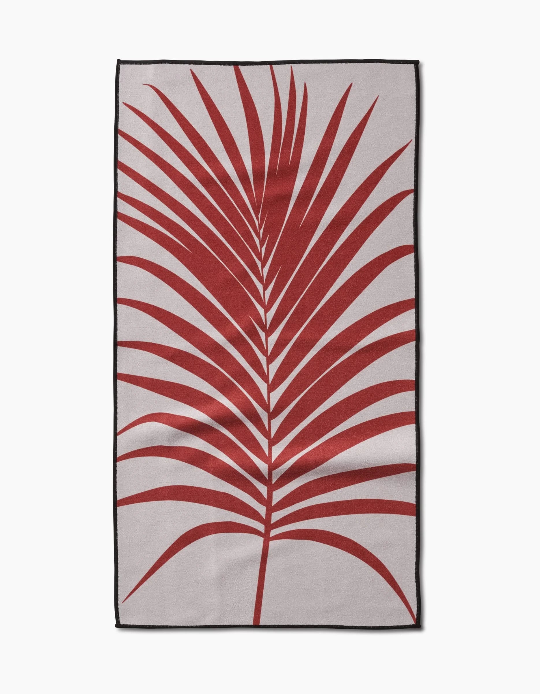 The Red Palm rug by PrintedPlant features a minimalist design with a bold red palm leaf on a beige background, accented by a black border and crafted from recycled materials for eco-friendly style.