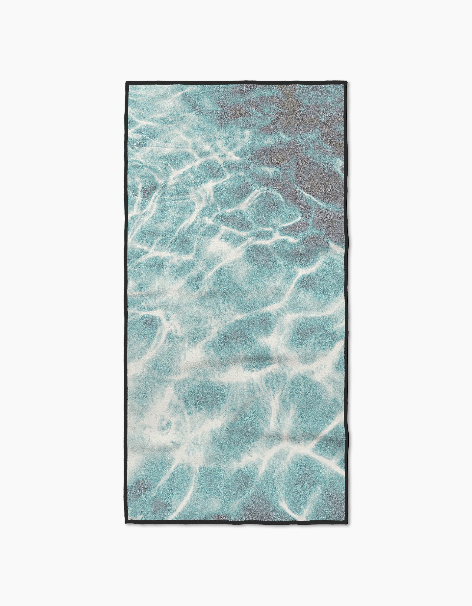 Geometry’s Saltwater Glow is a rectangular fitness towel with a lifelike aqua-blue water print, black edging, and made from ultra-absorbent recycled materials for top performance.