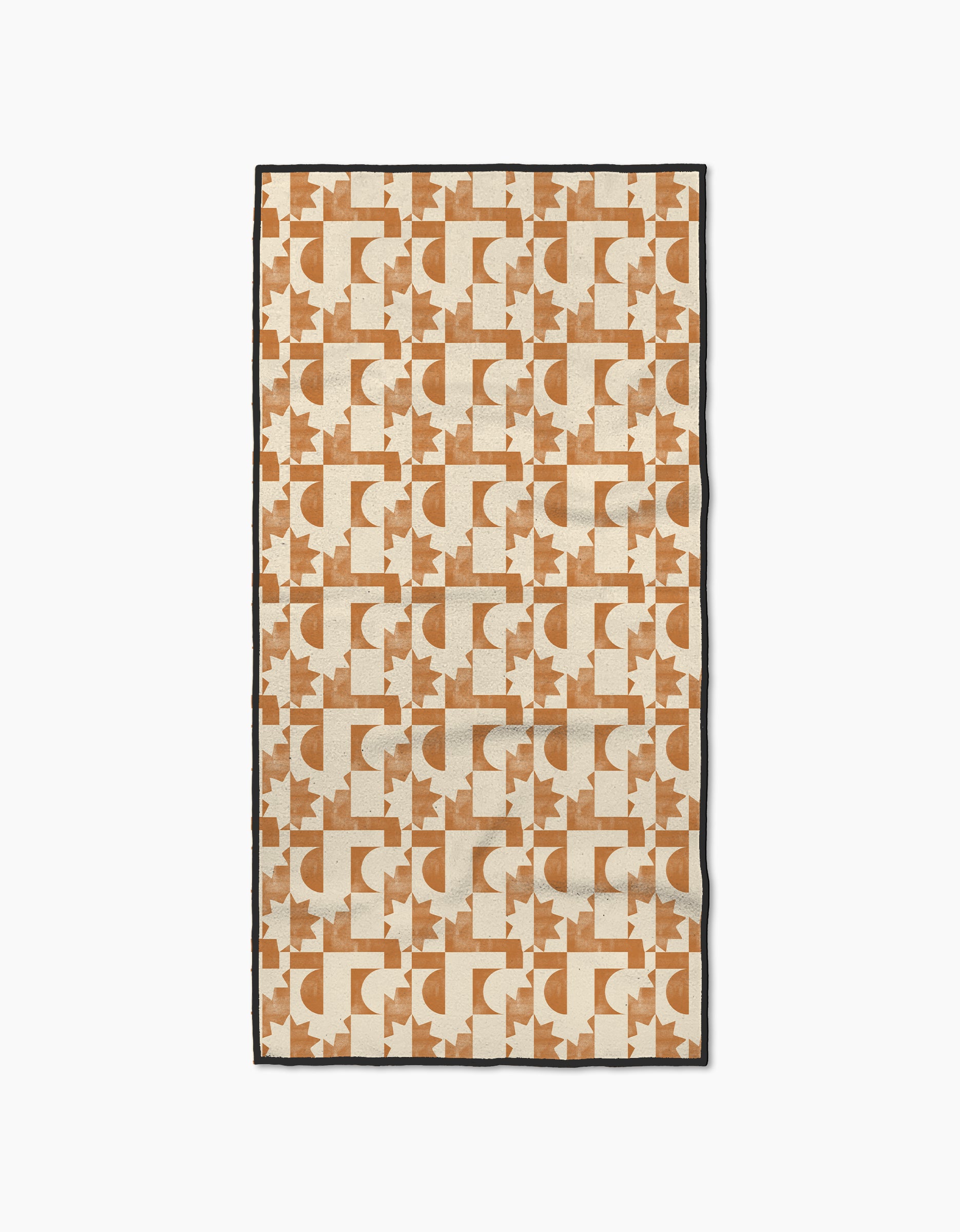 The Solar Power rug by Geometry is rectangular, made from recycled materials, and features repeating tan and rust geometric patterns—including semicircles, rectangles, and star-like shapes—on a cream background with a thin black border.