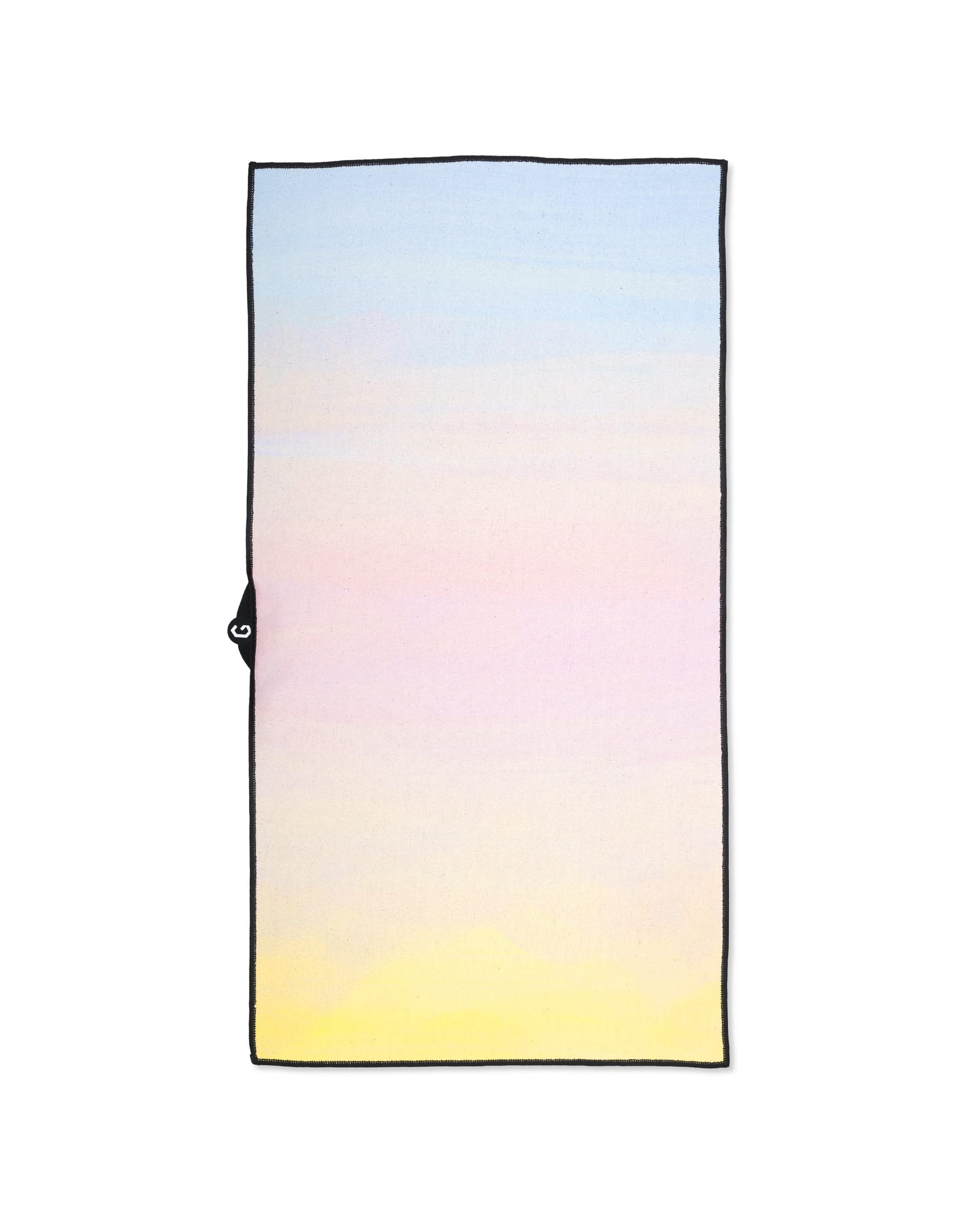 The GEOMETRY Magna - Sunrise is a rectangular fitness towel made from recycled materials, featuring a soft gradient from blue to yellow and a small black loop on one side.