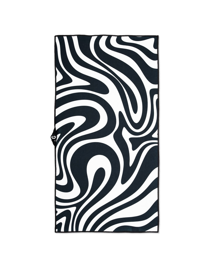 The GEOMETRY Magna - Swirls gym towel showcases a striking black and white abstract swirl design, creating a wavy, hypnotic effect on its ultra-absorbent rectangular surface.