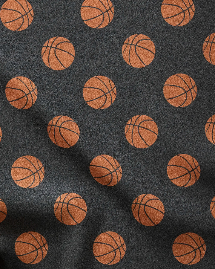 The Geometry Swish towel is a dark, ultra-absorbent fitness towel with evenly spaced orange basketballs, slight folds and texture—making it a stylish, fast-drying addition to your workout routine.