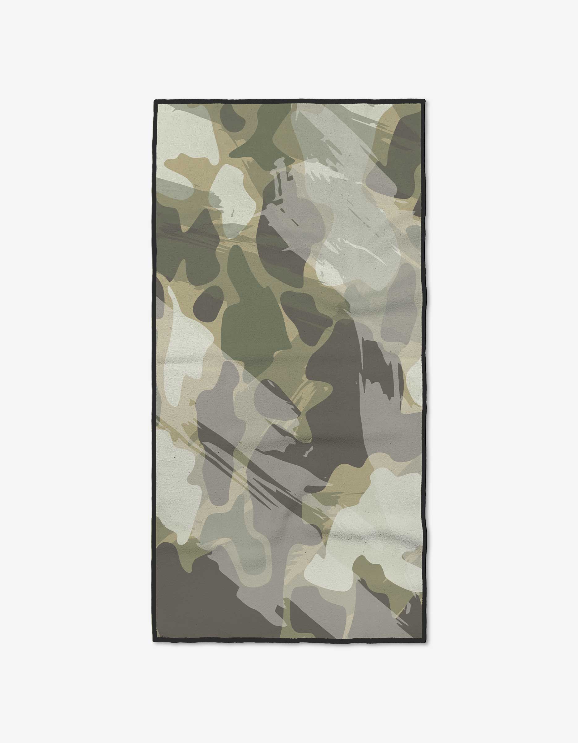 The GEOMETRY Wildscape is a rectangular fitness towel with a green, beige, and gray camouflage print. Made from recycled materials, this ultra-absorbent towel is shown flat on a white background.