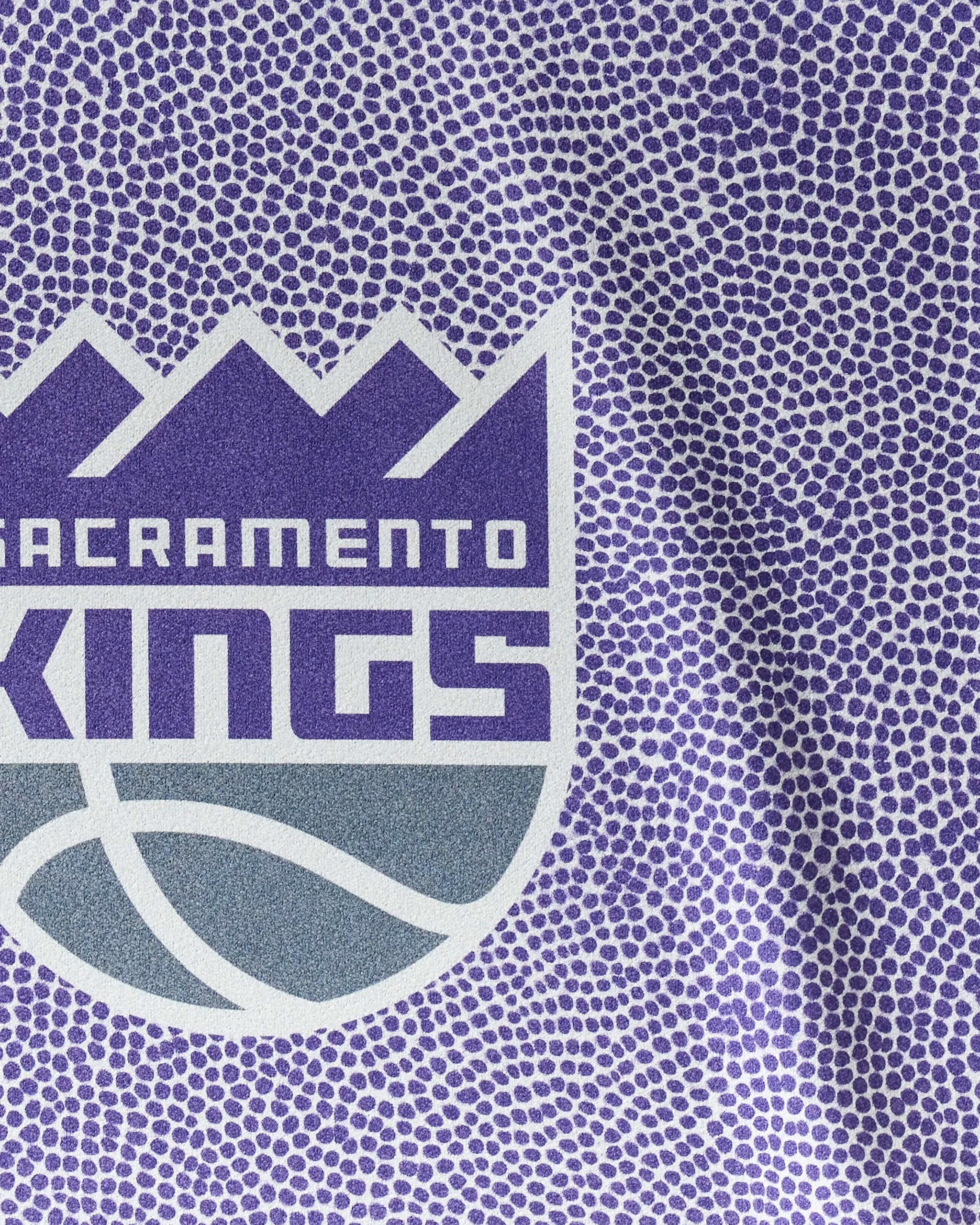 Close-up of the Kings Grip from NBALAB x Geometry—a textured purple basketball surface featuring the Sacramento Kings logo in white, gray, and purple. Perfect inspiration for your NBA fitness or quick-drying gym towel.