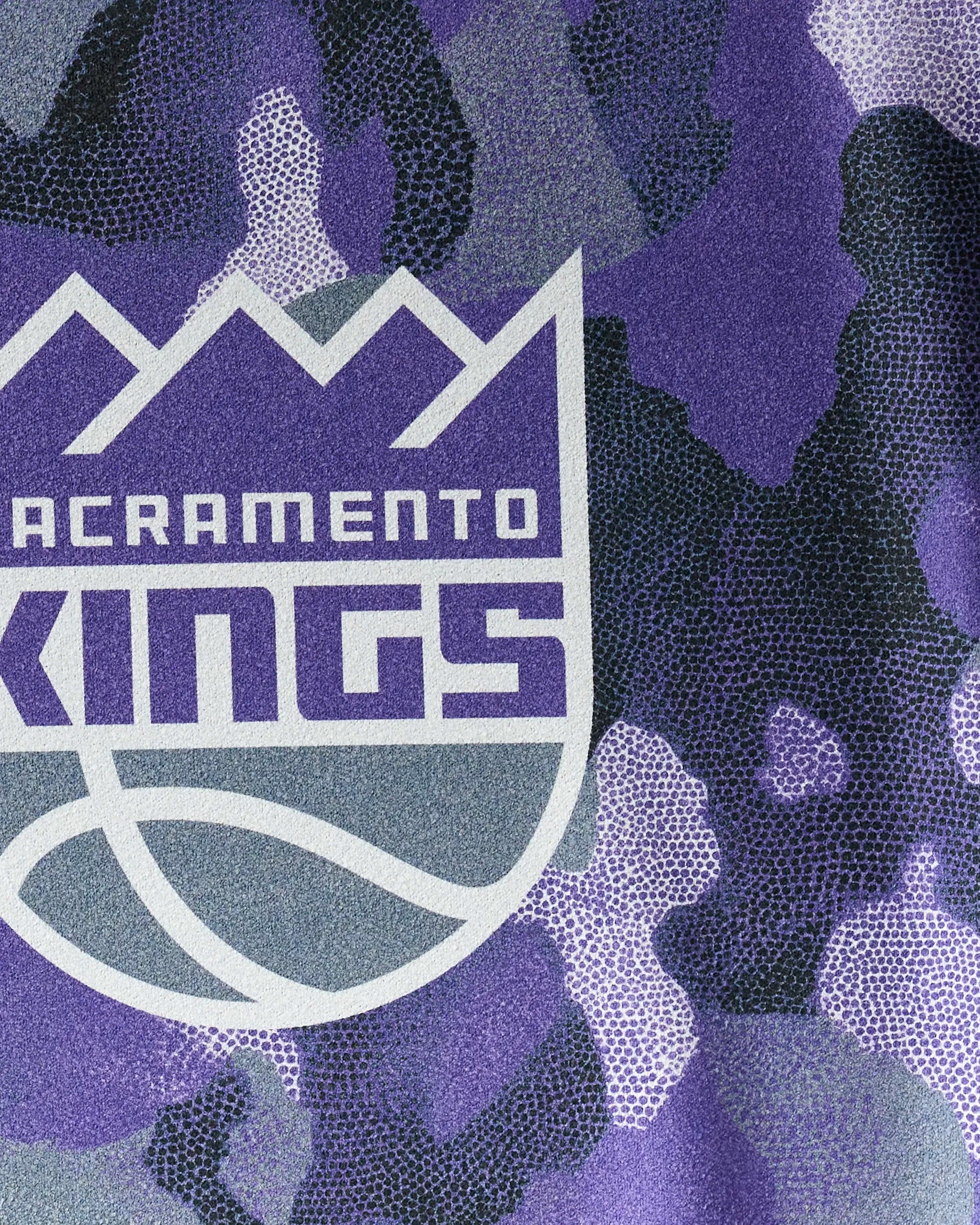 The NBALAB x Geometry Kings Camo towel features a close-up of the Sacramento Kings logo on purple, black, and white camo—perfect for showing team pride during workouts.