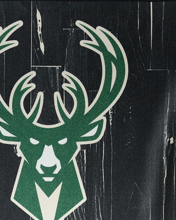 The Bucks Zone by NBALAB x Geometry features a stylized green and white deer head logo with antlers on a dark wood-textured background, ideal for an NBA fitness towel or quick-drying workout towel.