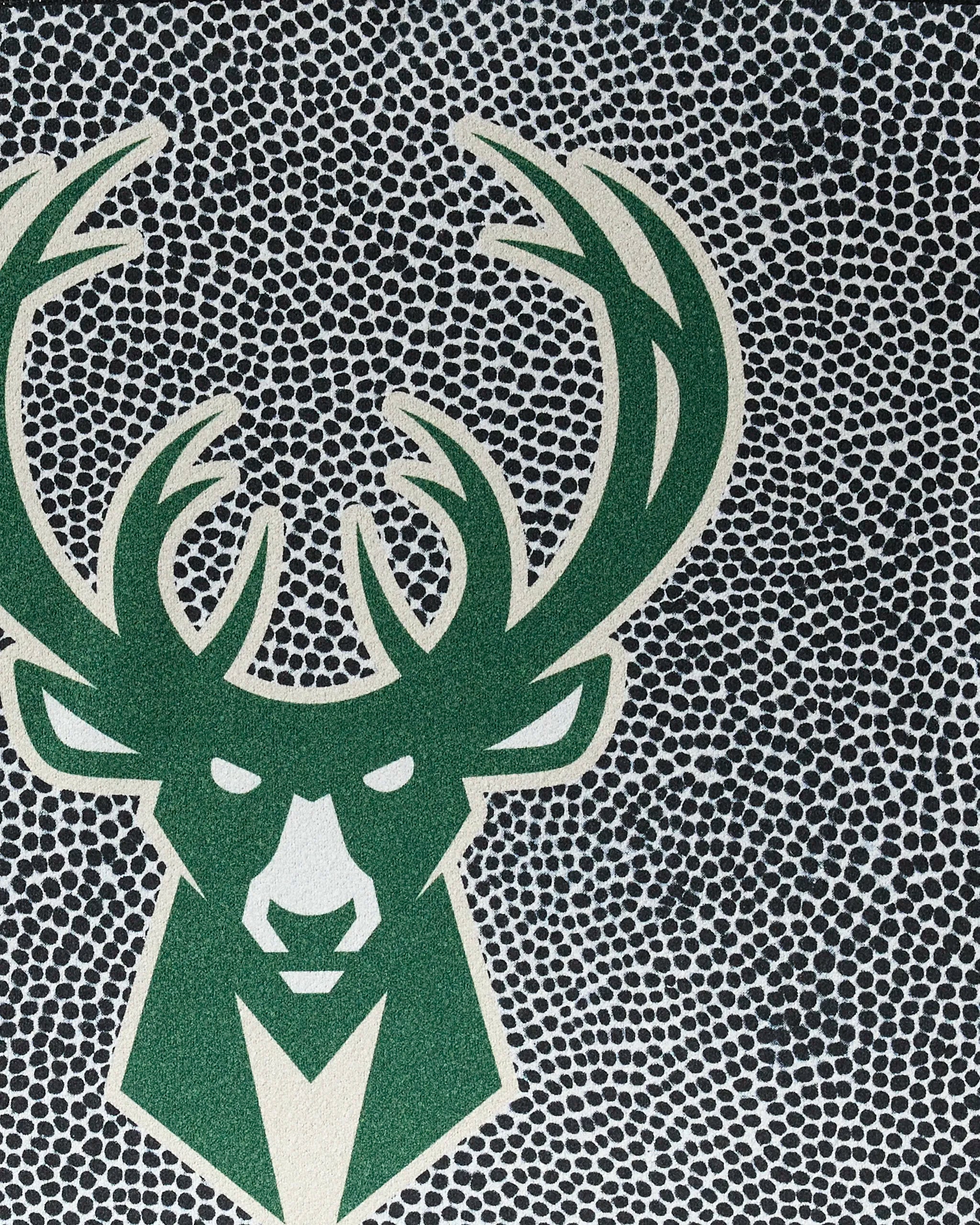 The Bucks Grip by NBALAB x Geometry features a stylized green deer head with large antlers on a black and white dotted background, echoing Milwaukee Bucks vibes—ideal as your NBA-inspired fitness towel.