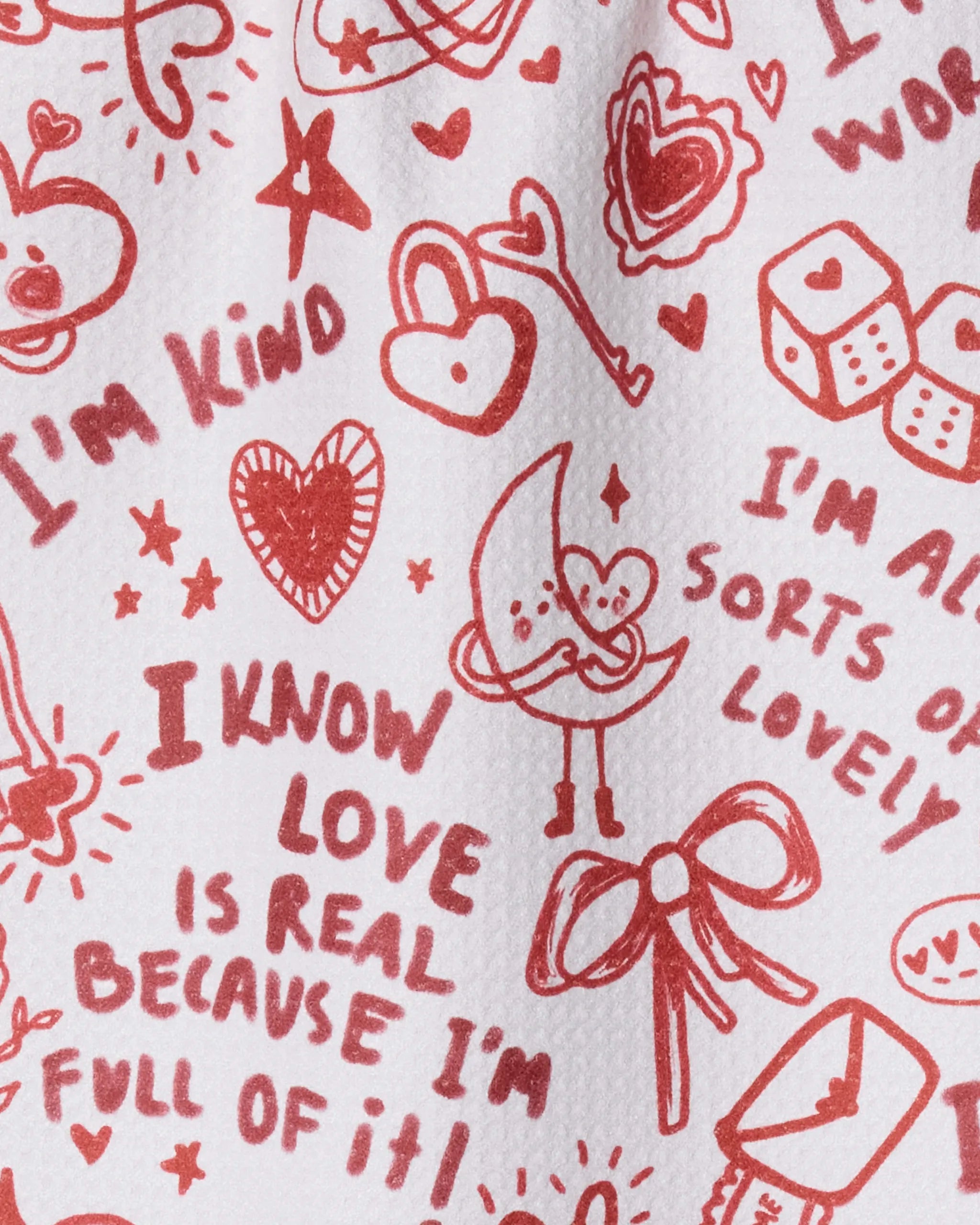 The Geometry "Valentines Affirmations" bar towel features hand-drawn red doodles, hearts, stars, a bow, and uplifting phrases like “I’m kind” on an ultra-absorbent white background.