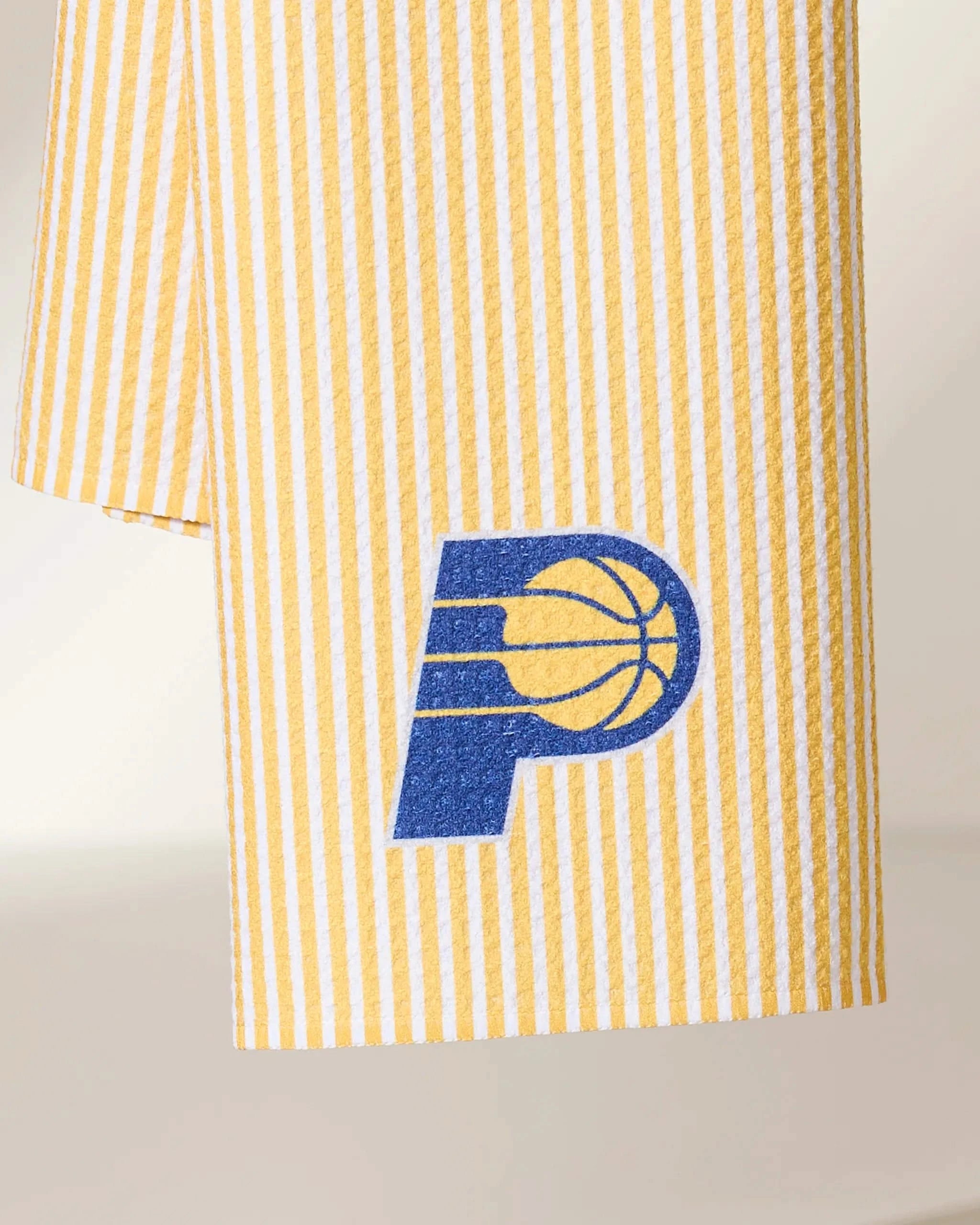 The Geometry Pacers Classic is a yellow and white striped towel featuring the Indiana Pacers blue and yellow team logo near the edge.