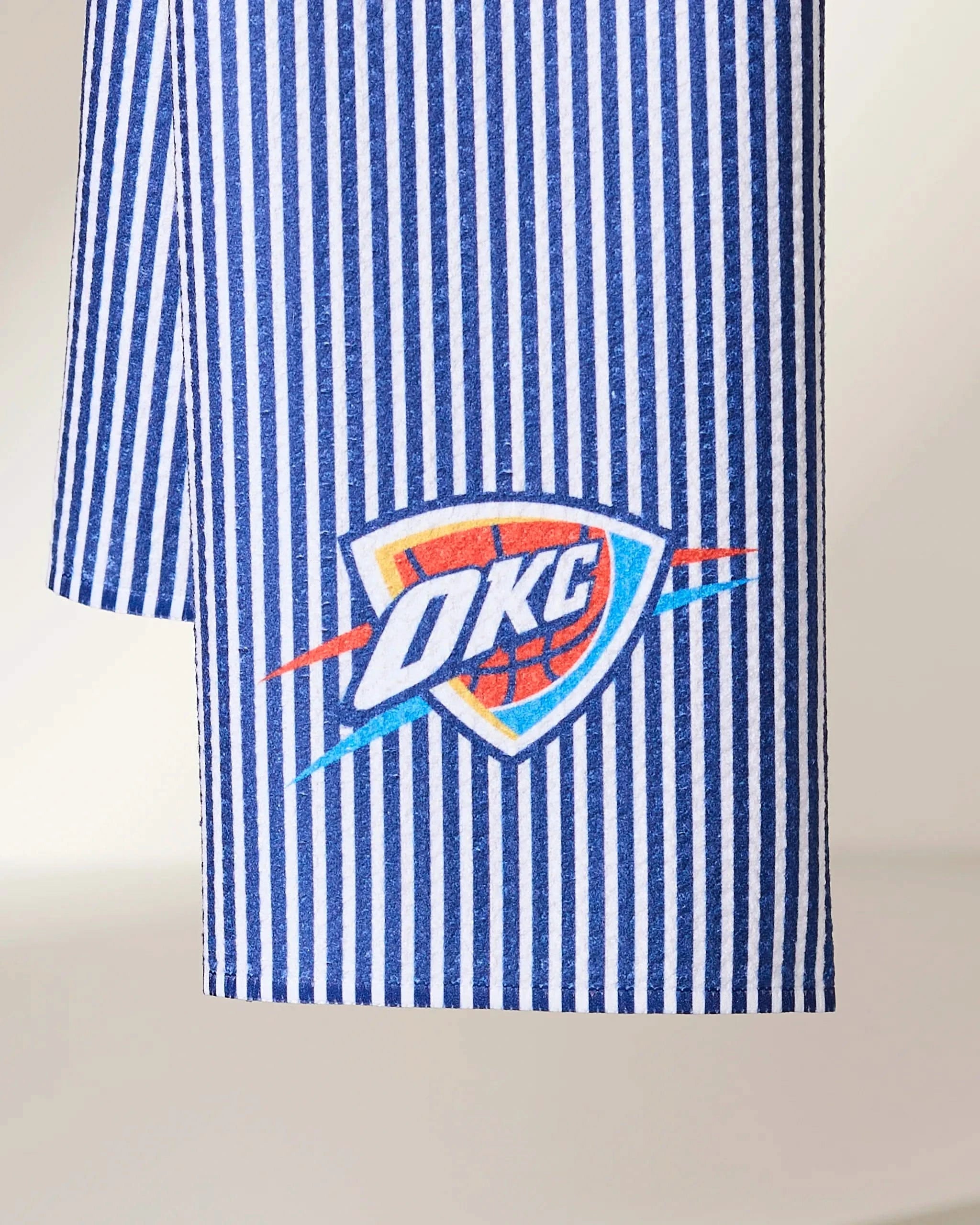 The Geometry OKC Classic features blue and white vertical stripes with the Oklahoma City Thunder logo printed near the bottom.
