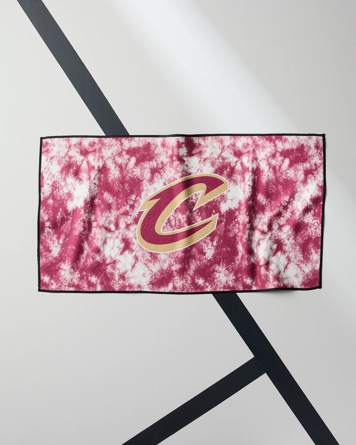 The NBALAB x Geometry Cavaliers Flash workout towel features maroon and white tie-dye with a bold gold and maroon C logo at the center, displayed on a white surface with black diagonal lines.