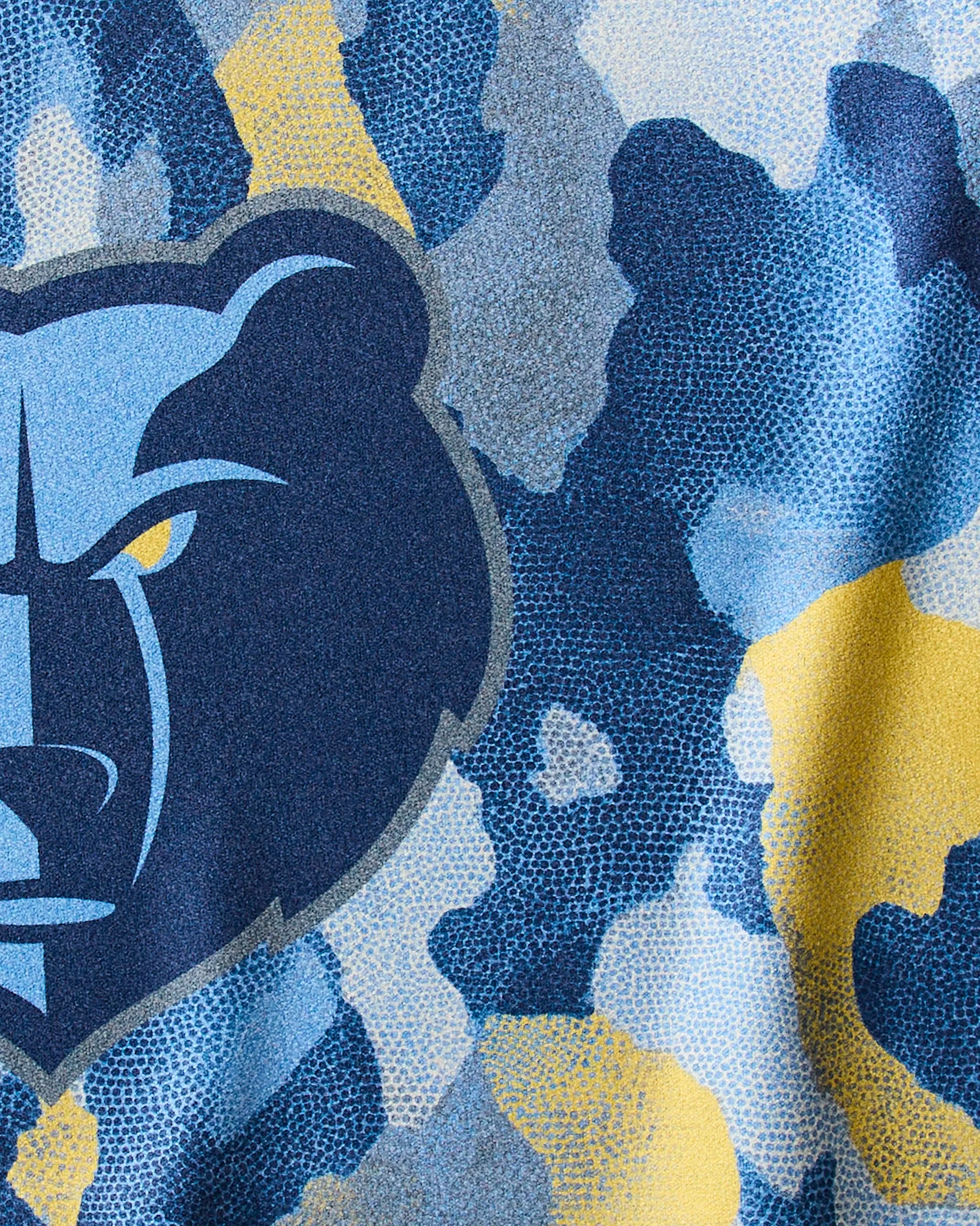 Close-up of Geometry's Grizzlies Camo fabric in blue, gray, and yellow, featuring a bold bear face logo—ideal for an NBA-ready fitness or quick-drying gym towel.