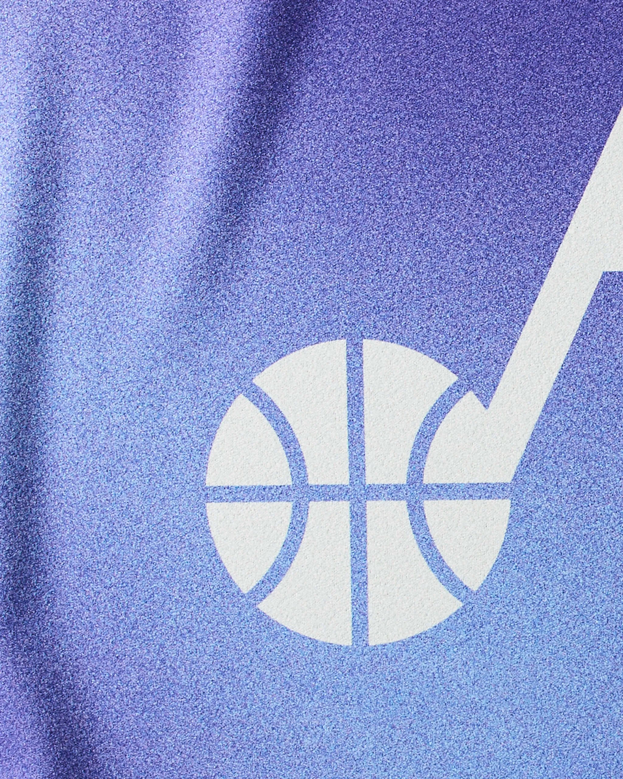 Close-up of the Geometry Jazz Fade towel’s blue and purple texture, featuring a white basketball and musical note graphic inspired by Utah Jazz—ideal as an NBA fitness or quick-drying workout towel.