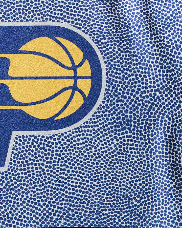 Close-up of the NBALAB x Geometry Pacers Grip towel, showing a blue stylized P with a yellow basketball on a textured, pebble-patterned blue and white NBA fitness design.
